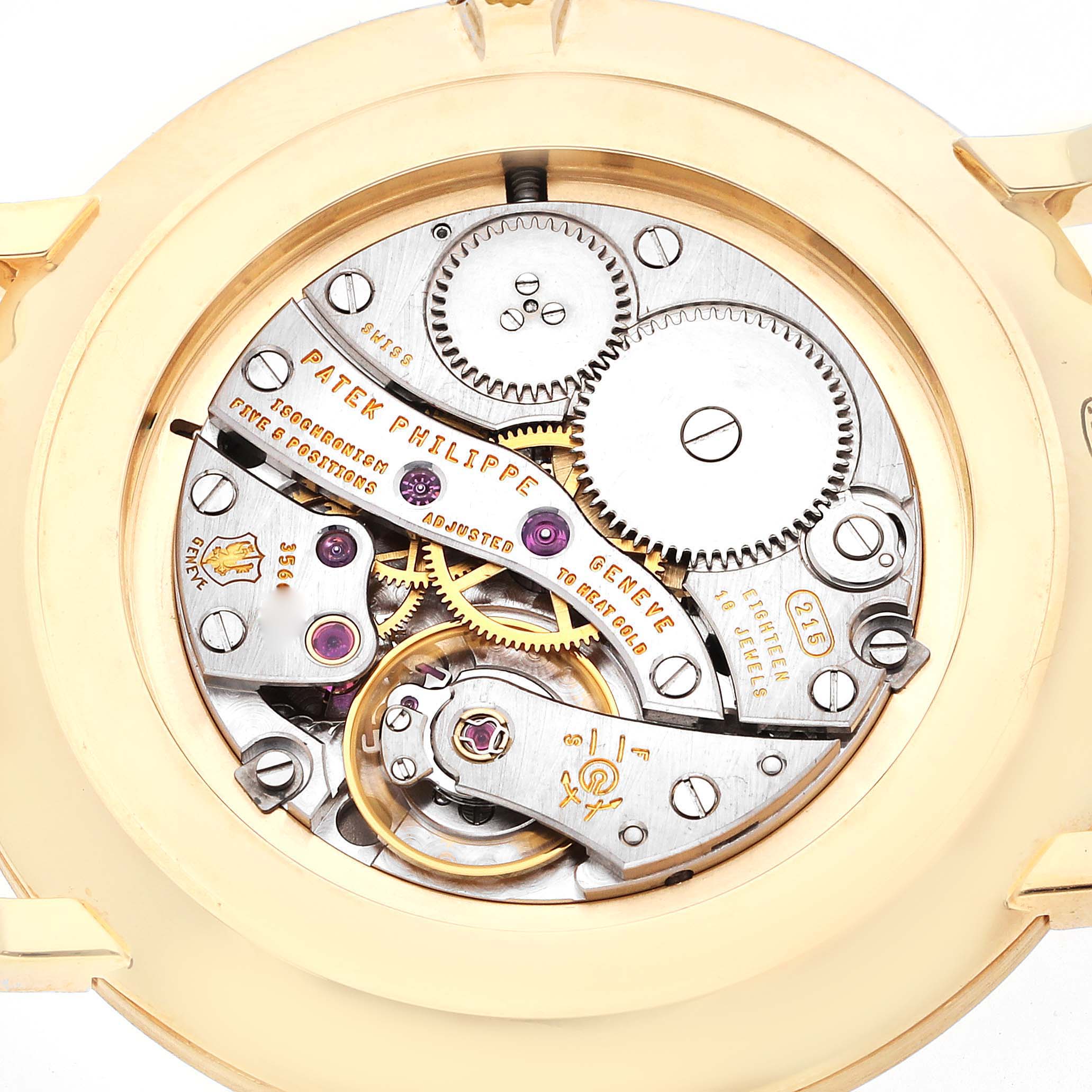 This image shows the intricate internal mechanical movement of a Patek Philippe Calatrava 5119J Men's Yellow Gold White Dial 5119J Men's Yellow Gold White Dial watch from the back.