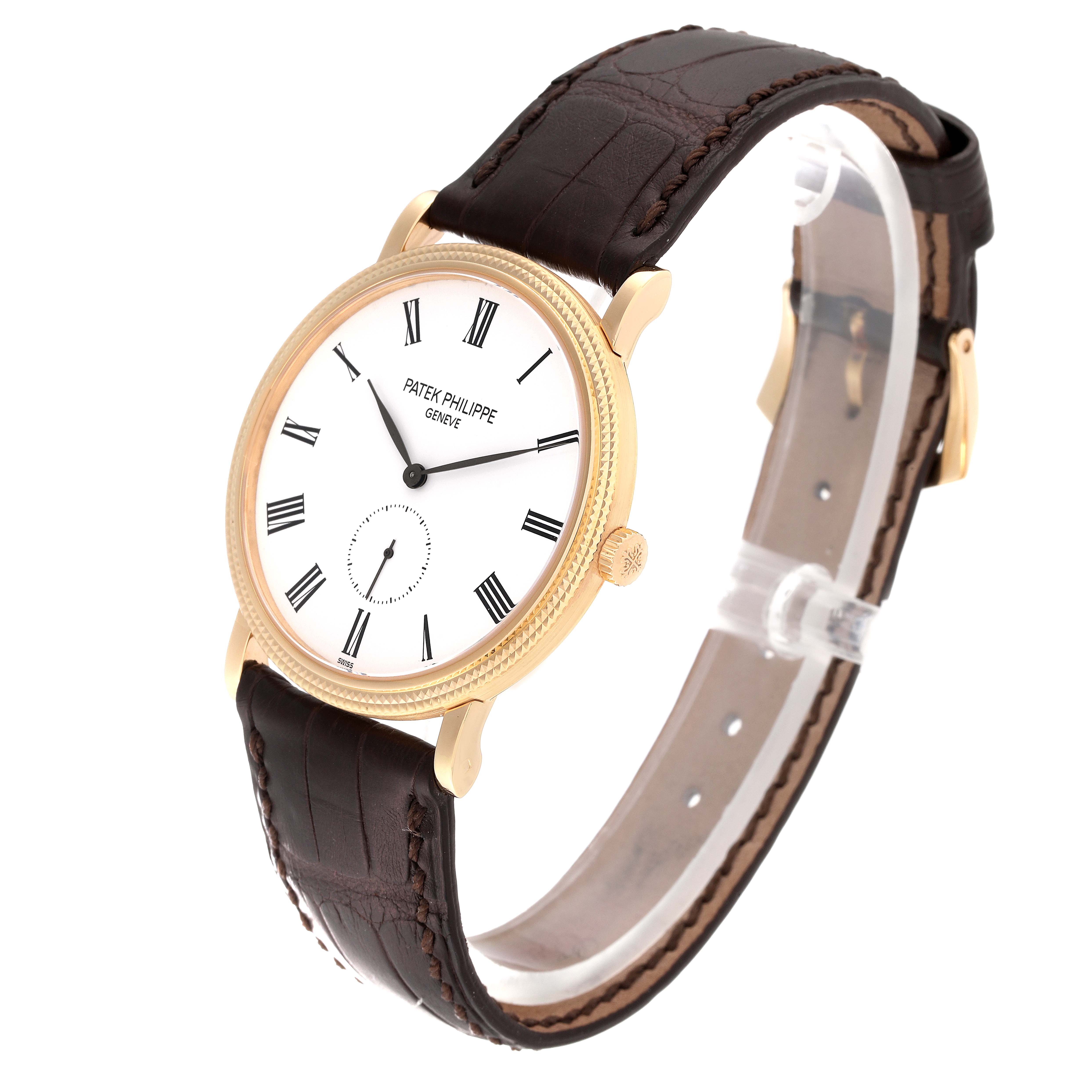 The image shows a front-side view of the Patek Philippe Calatrava 5119J Men's Yellow Gold White Dial 5119J Men's Yellow Gold White Dial watch with a white dial and brown leather strap.
