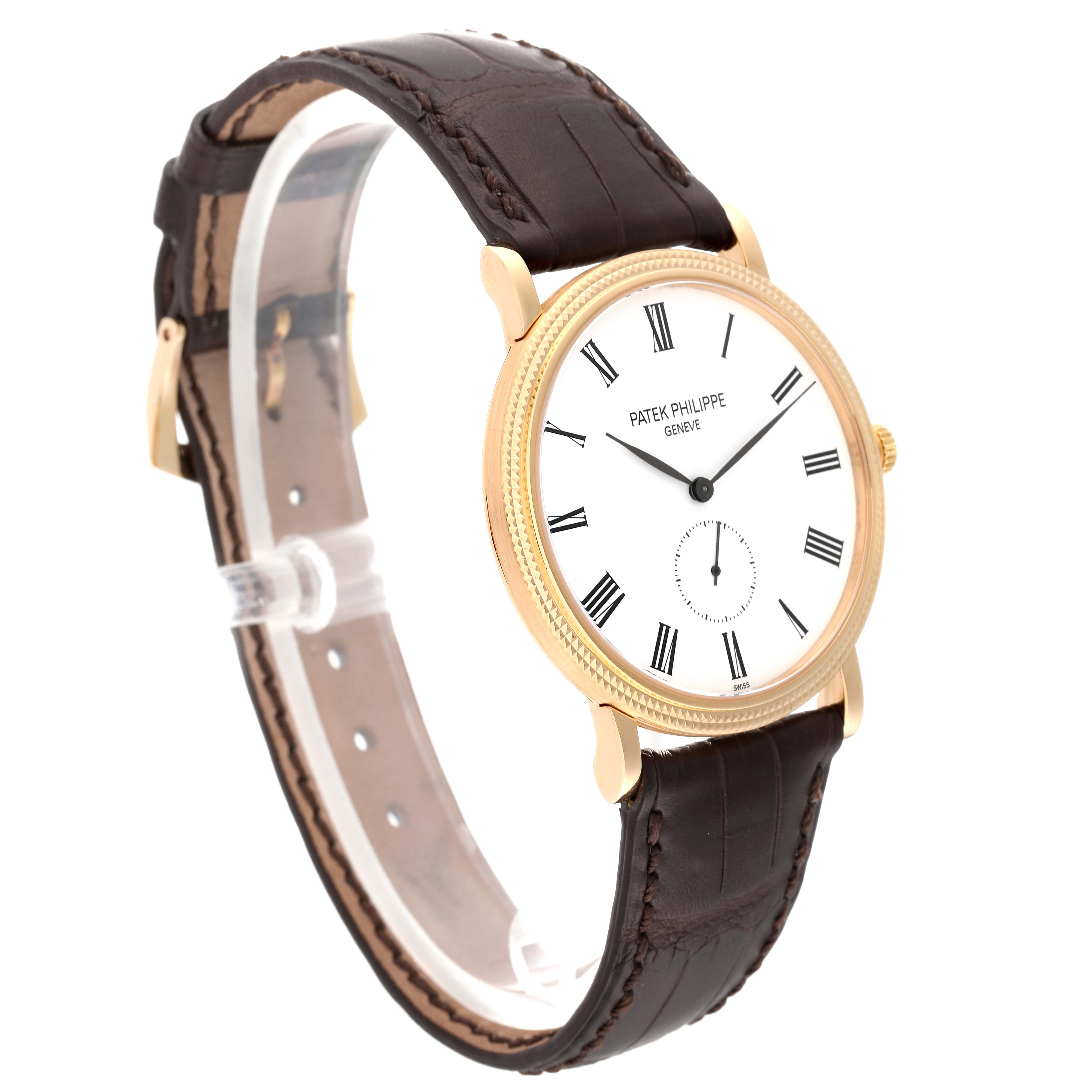 The Patek Philippe Calatrava 5119J Men's Yellow Gold White Dial 5119J Men's Yellow Gold White Dial watch is shown at a side angle displaying its dial, gold case, and brown leather strap.