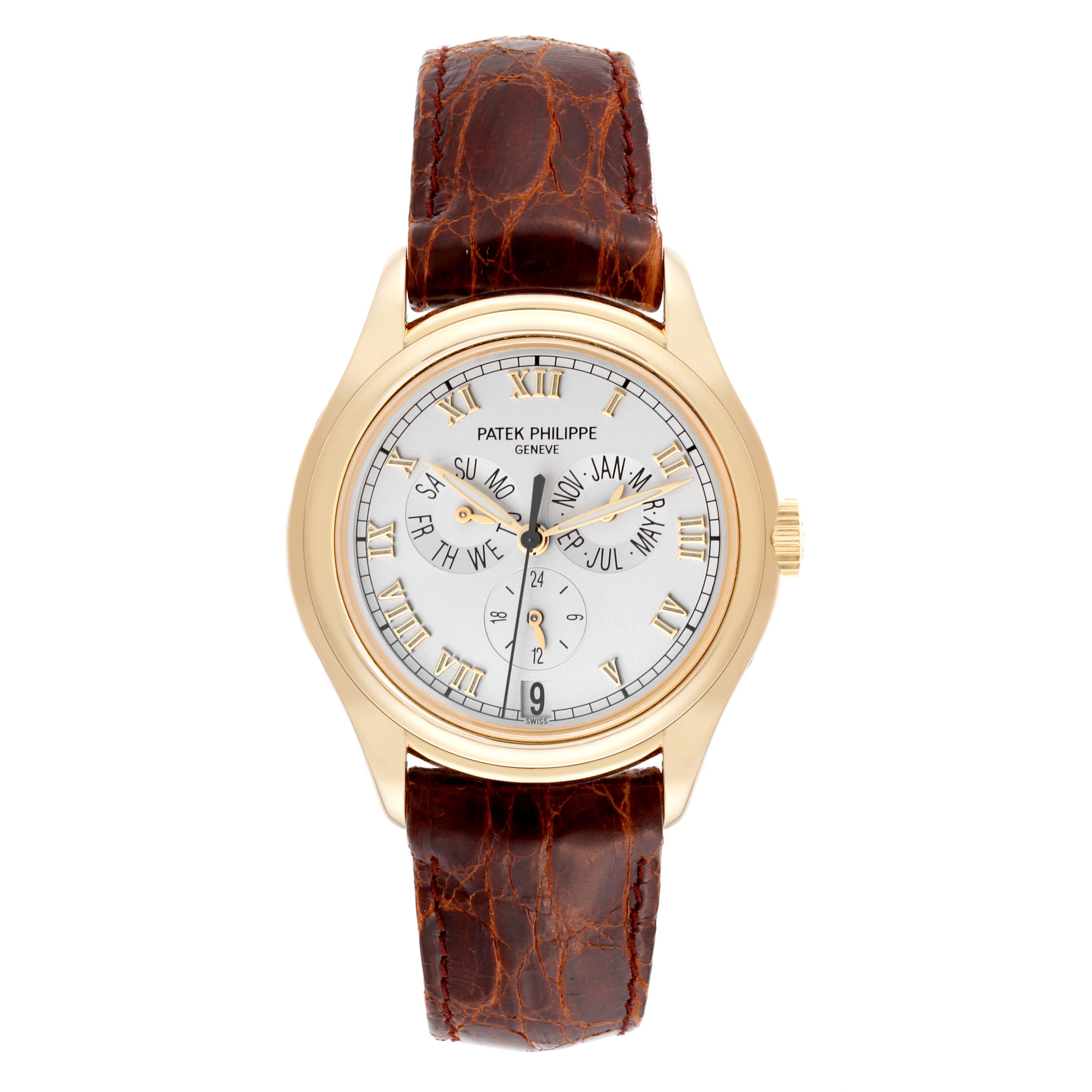 The Patek Philippe Complications 5035J-001 Men
s Yellow Gold Silver Dial 5035J-001 Men
s Yellow Gold Silver Dial watch is shown from a front angle, displaying its brown leather strap and white dial with Roman numerals.
