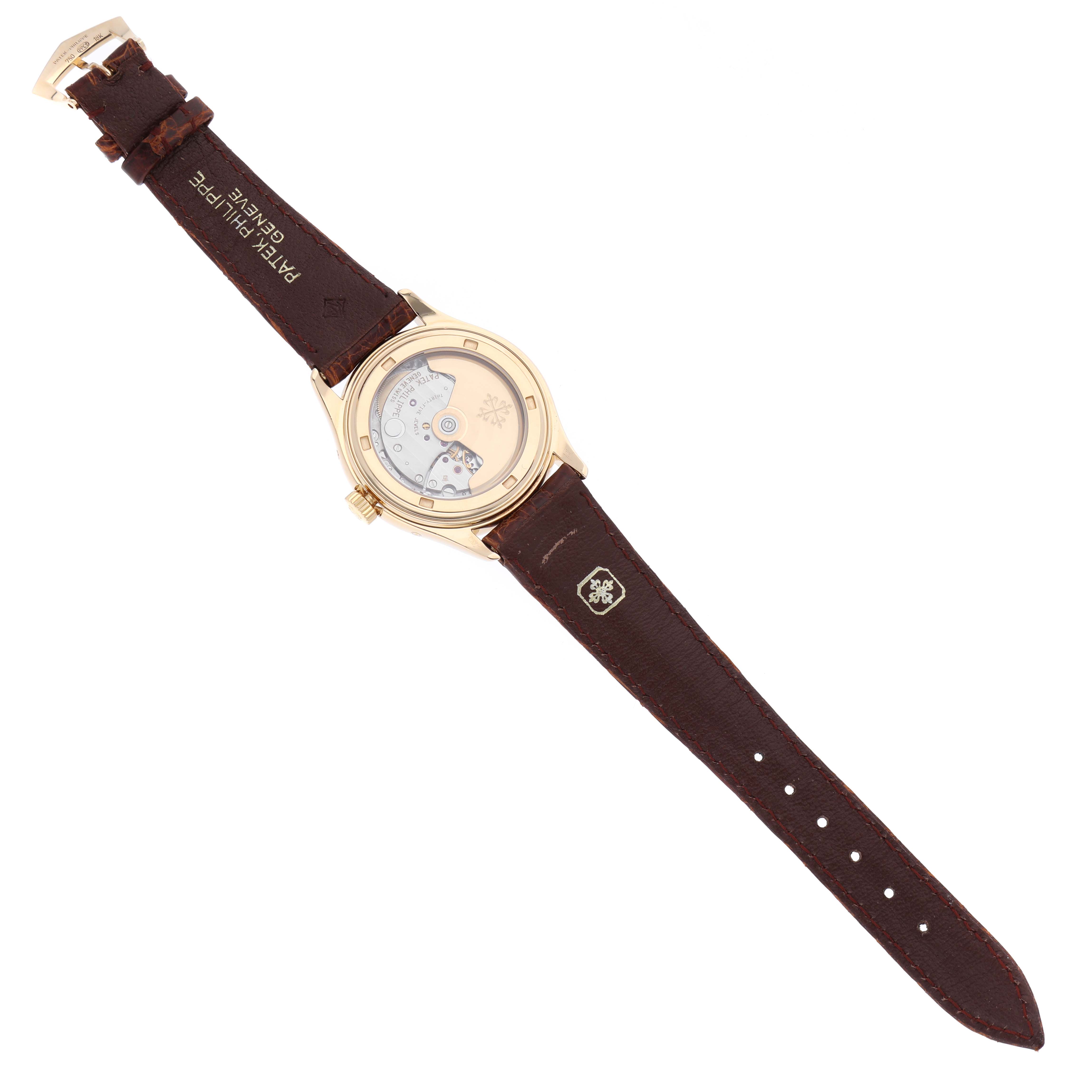 This image shows the back view of the Patek Philippe Complications 5035J-001 Men
s Yellow Gold Silver Dial 5035J-001 Men
s Yellow Gold Silver Dial model watch, displaying the movement and leather strap.