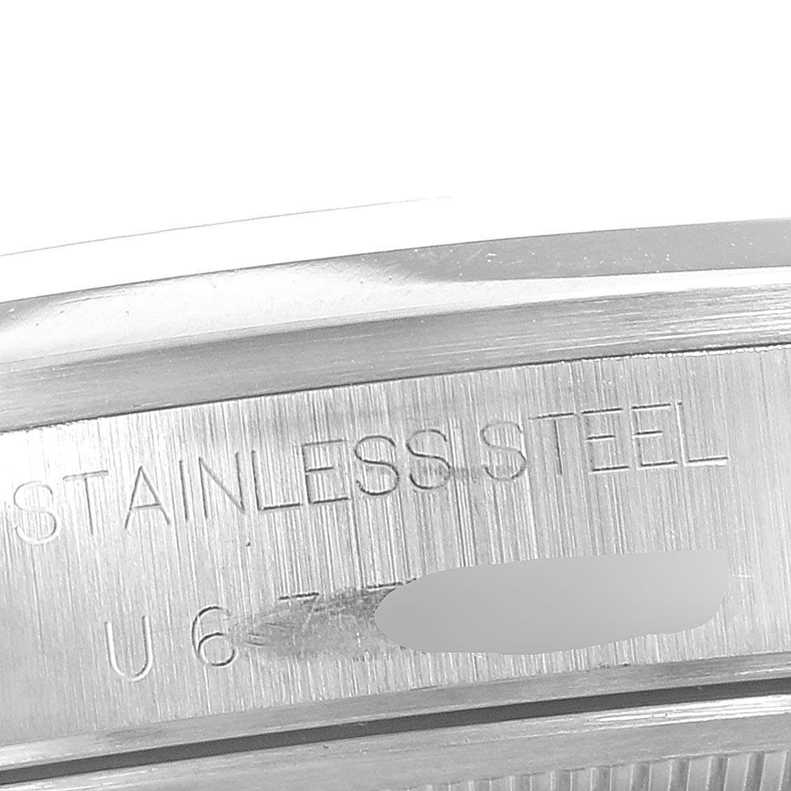 This is a close-up of the stainless steel part of a Rolex Air-King 14000 Men's Stainless Steel Blue Dial 14000 Men's Stainless Steel Blue Dial watch, showing the engraved text.