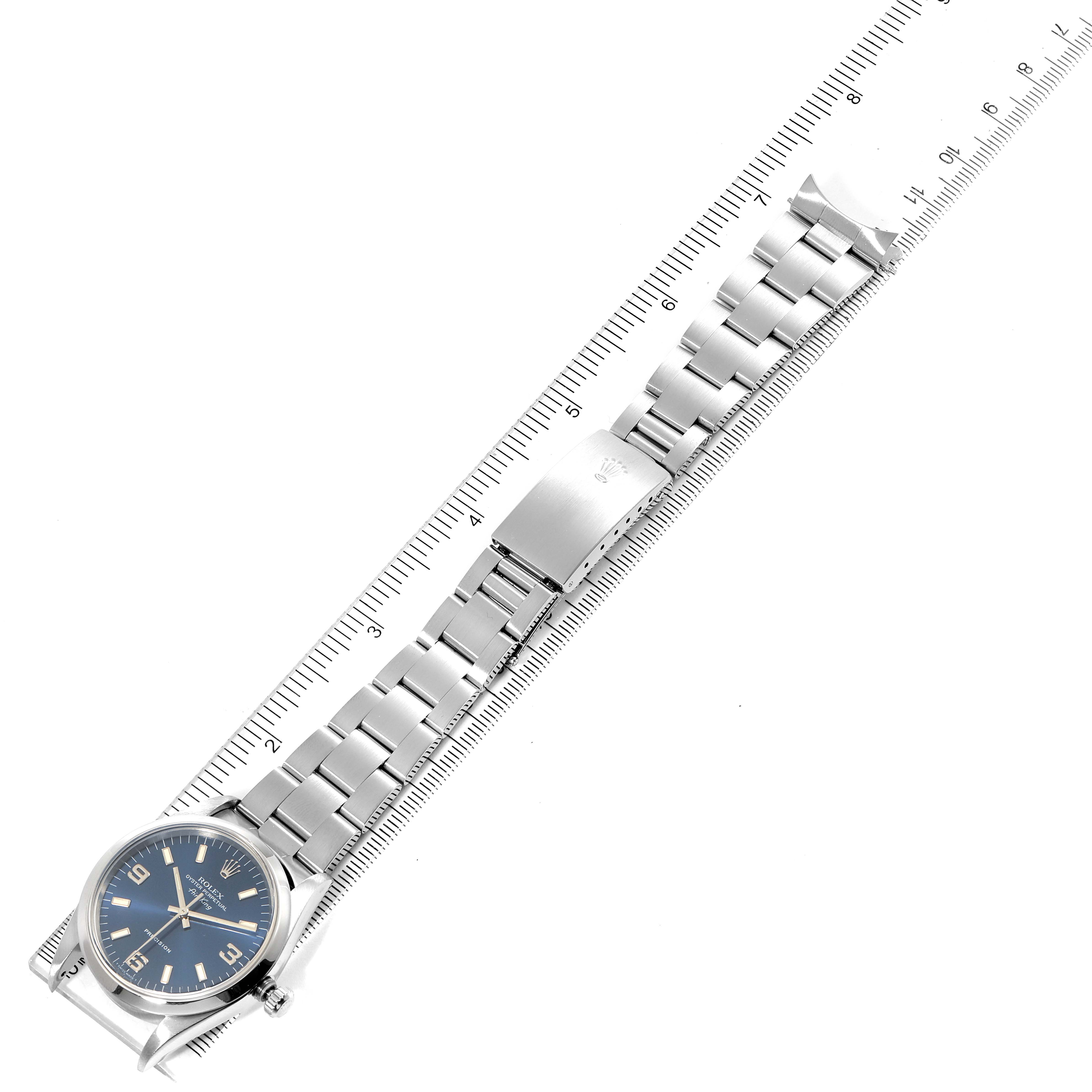 The image shows a top-down view of a Rolex Air-King 14000 Men's Stainless Steel Blue Dial 14000 Men's Stainless Steel Blue Dial watch with its metal bracelet fully extended and measured against a ruler.