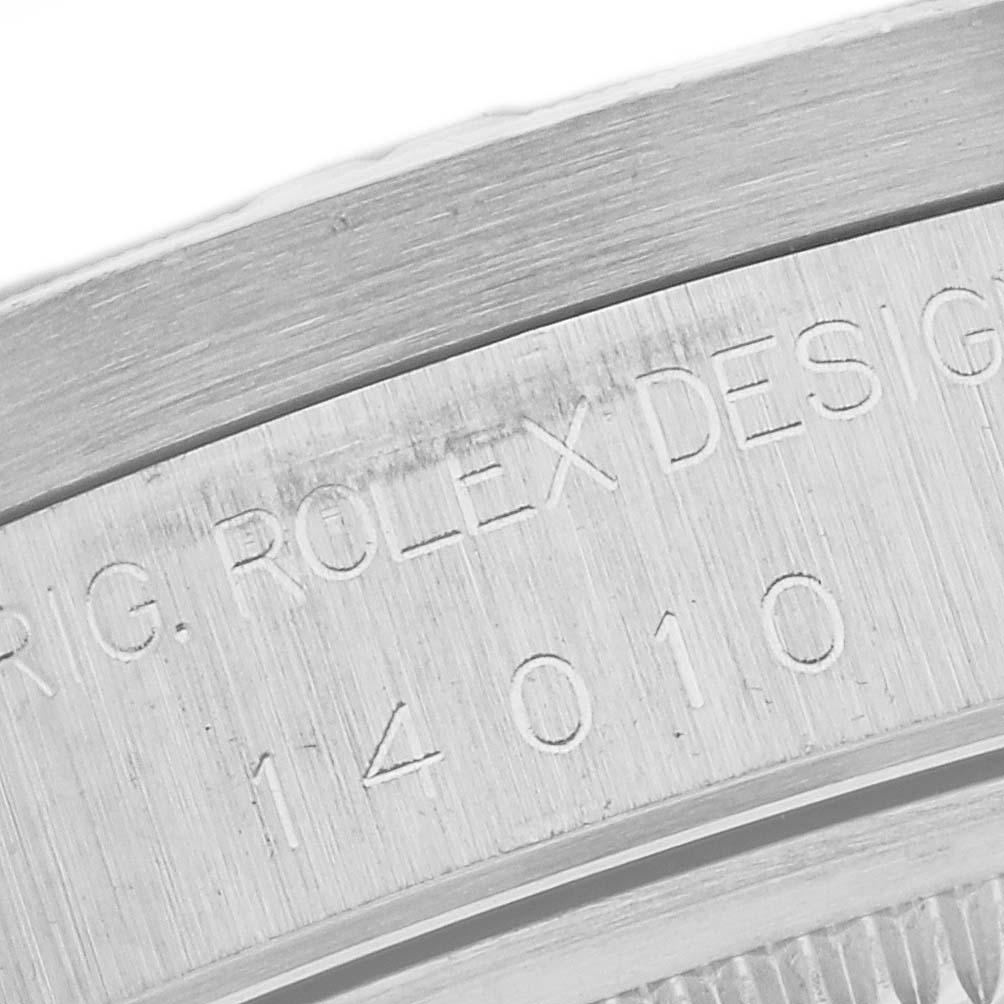 The image shows a close-up of the engraved text on the case of a Rolex Air-King 14010 Men's Stainless Steel Black Dial 14010 Men's Stainless Steel Black Dial watch.