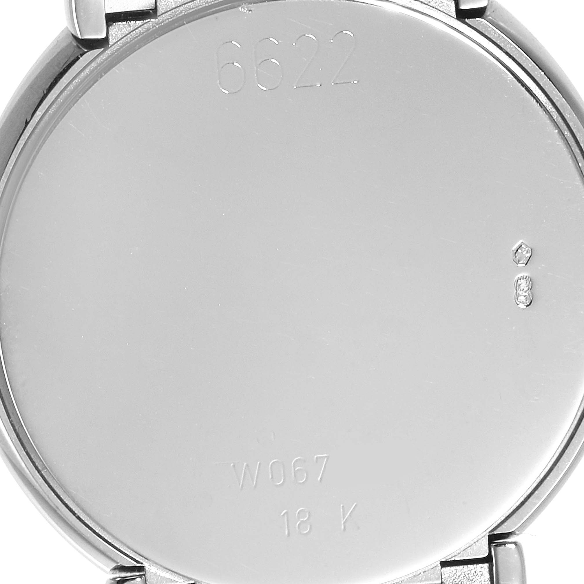 This image shows the back case of a Rolex Cellini 6622 Women's White Gold Blue Dial 6622 Women's White Gold Blue Dial watch with engravings and hallmarks.