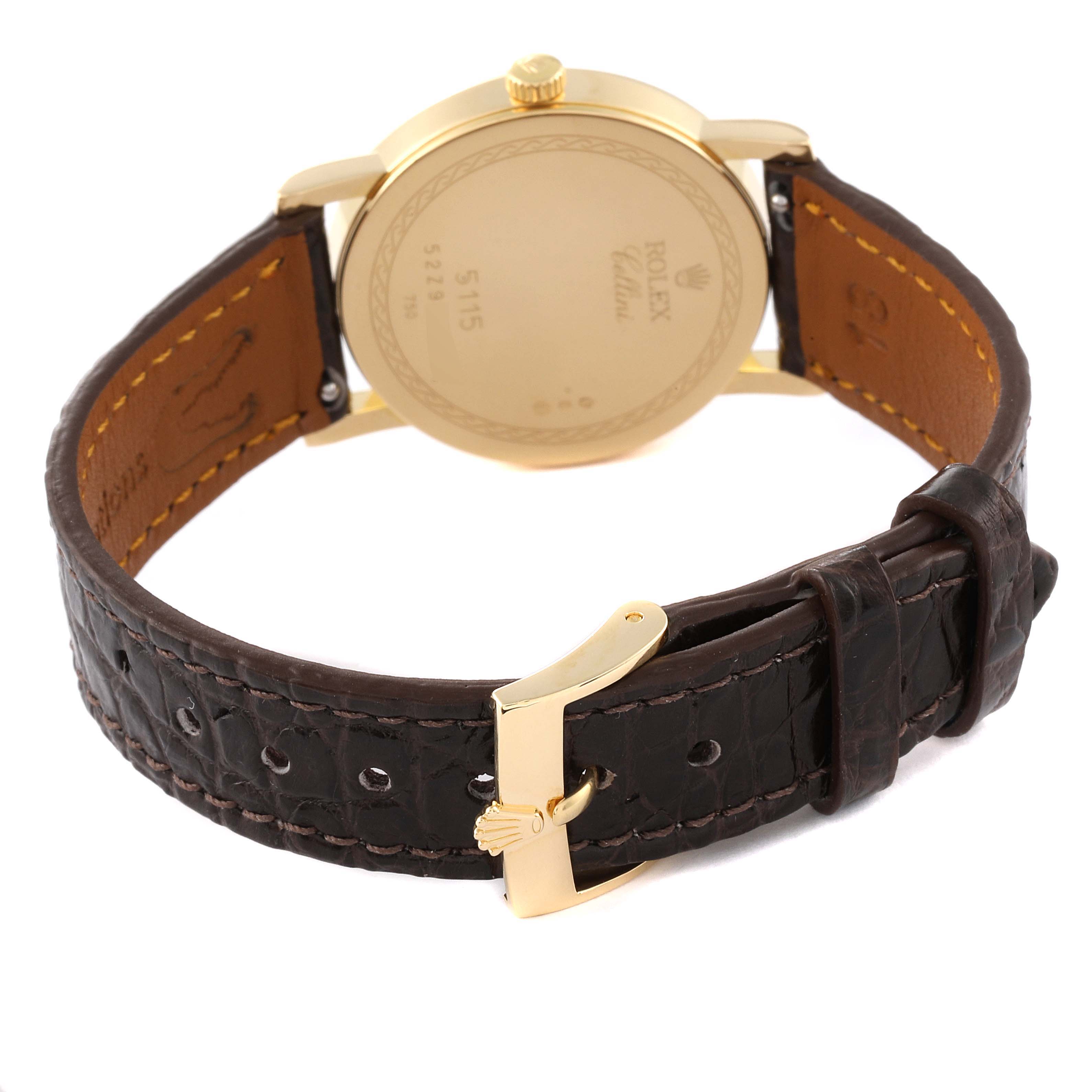 The image shows the back and side view of the Rolex Cellini 5115 Men's Yellow Gold Champagne Dial 5115 Men's Yellow Gold Champagne Dial watch, highlighting its leather strap and gold case back.