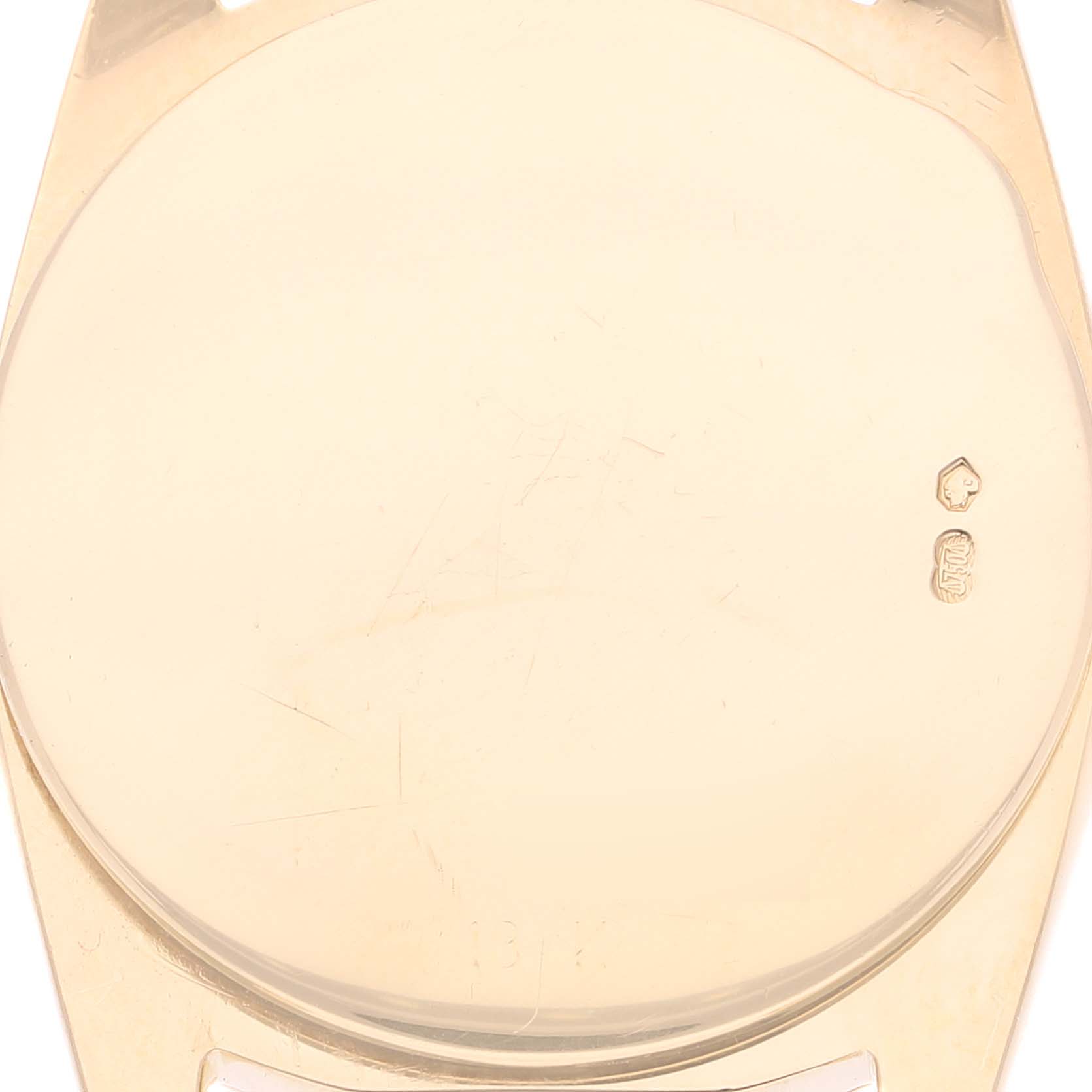 The image shows the back case of a Rolex Cellini 6229 Women's Yellow Gold White Dial 6229 Women's Yellow Gold White Dial watch, viewed from a top angle.