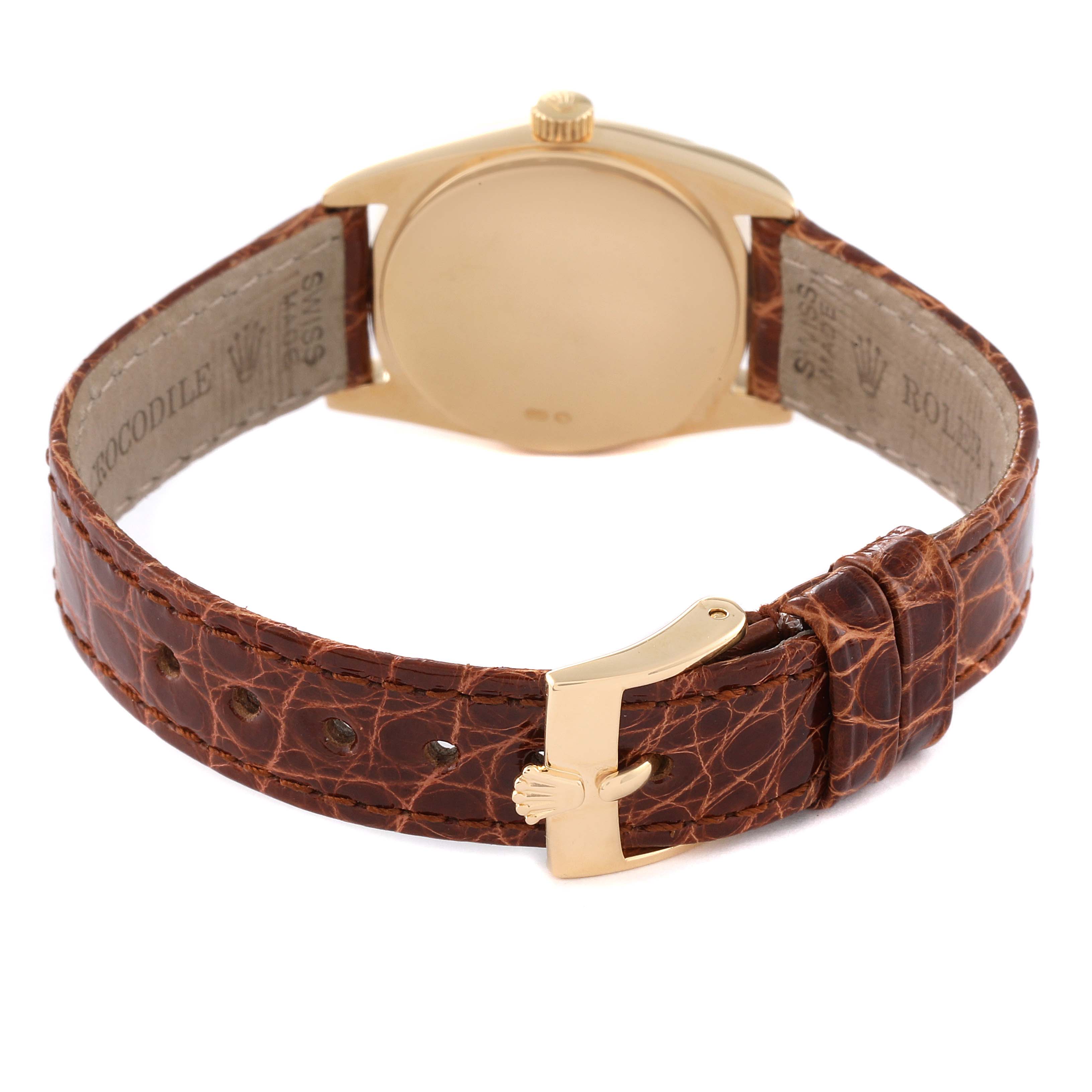 This image shows the back case and brown leather strap of the Rolex Cellini 6229 Women's Yellow Gold White Dial 6229 Women's Yellow Gold White Dial watch.