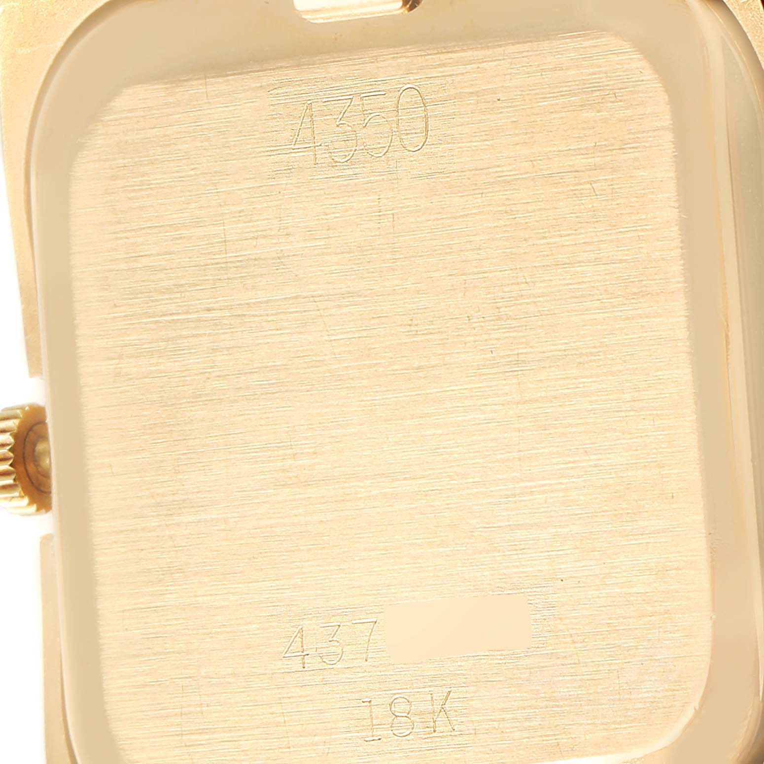 This image shows the back of a Rolex Cellini 4350 Men's Yellow Gold Brown Dial 4350 Men's Yellow Gold Brown Dial model, highlighting parts of the case back and crown.