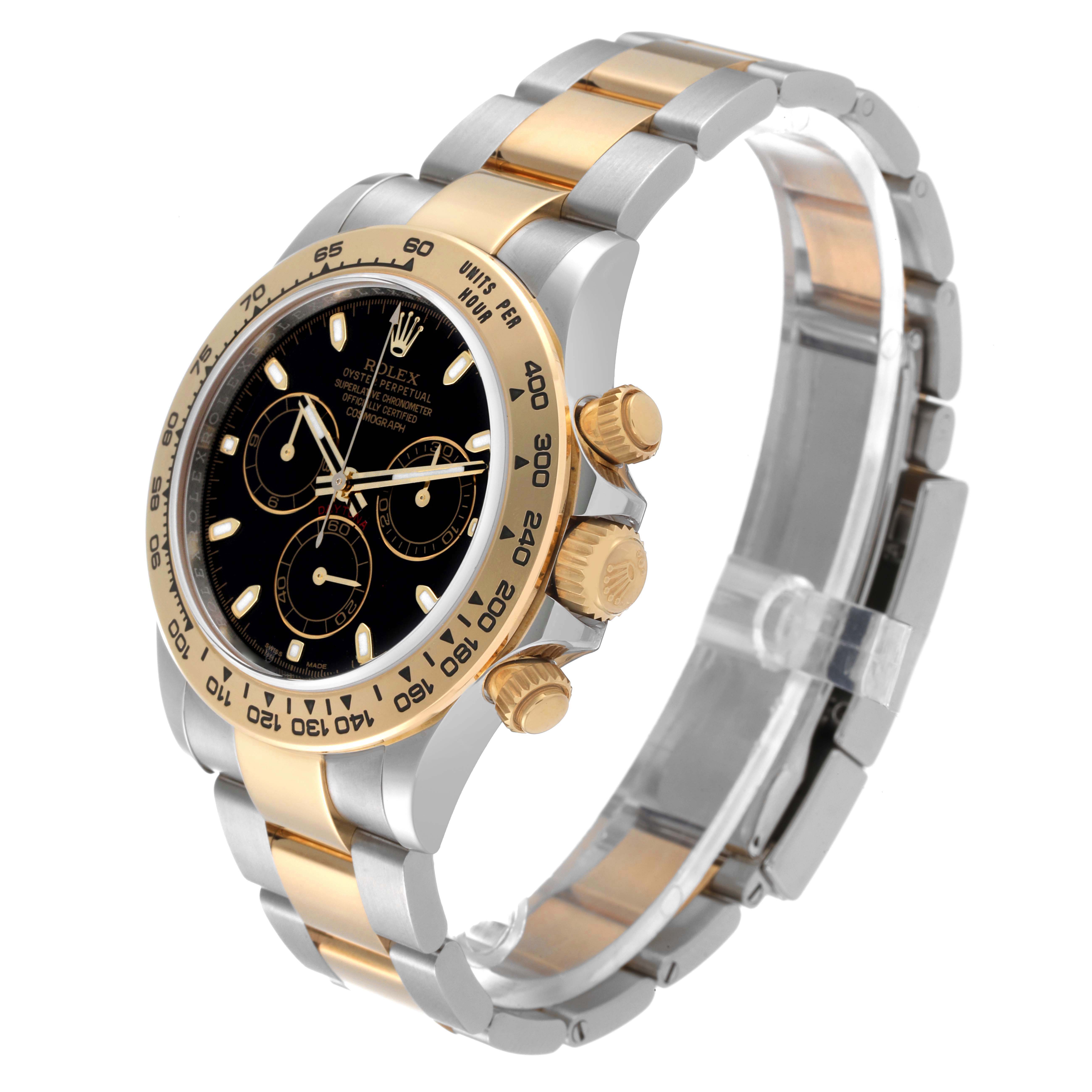 The image shows a side and angled view of a Rolex Daytona 116503 Men's Steel and Gold (two tone) Black Dial 116503 Men's Steel and Gold (two tone) Black Dial watch, highlighting its black dial, gold bezel, and two-tone bracelet.