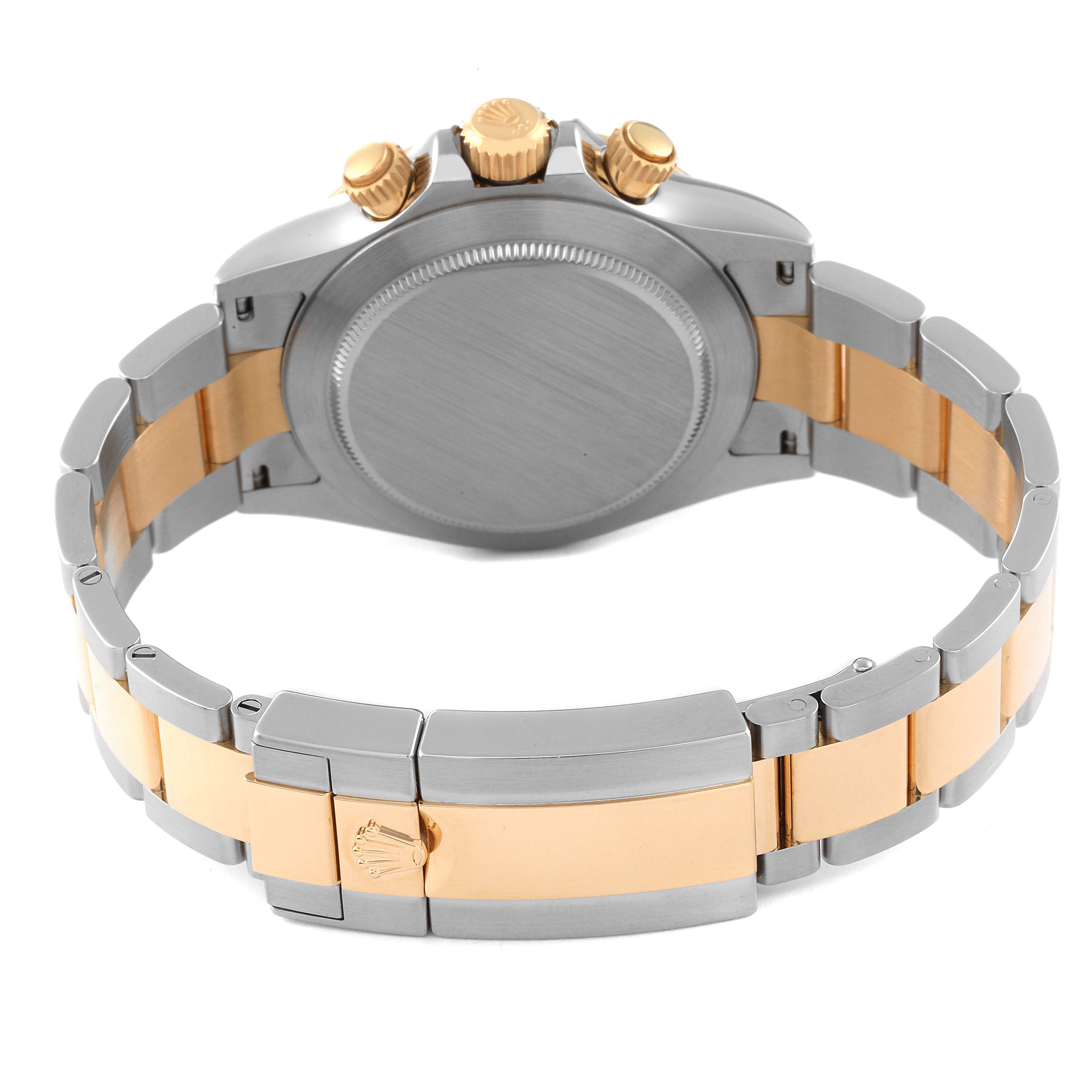 This image shows the back view of a Rolex Daytona 116503 Men's Steel and Gold (two tone) Black Dial 116503 Men's Steel and Gold (two tone) Black Dial watch, highlighting its metal bracelet and clasp.