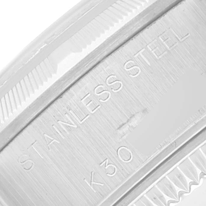 This close-up image shows the stainless steel band and part of the bezel of a Rolex Datejust 79190 Women's Stainless Steel Blue Dial 79190 Women's Stainless Steel Blue Dial watch.