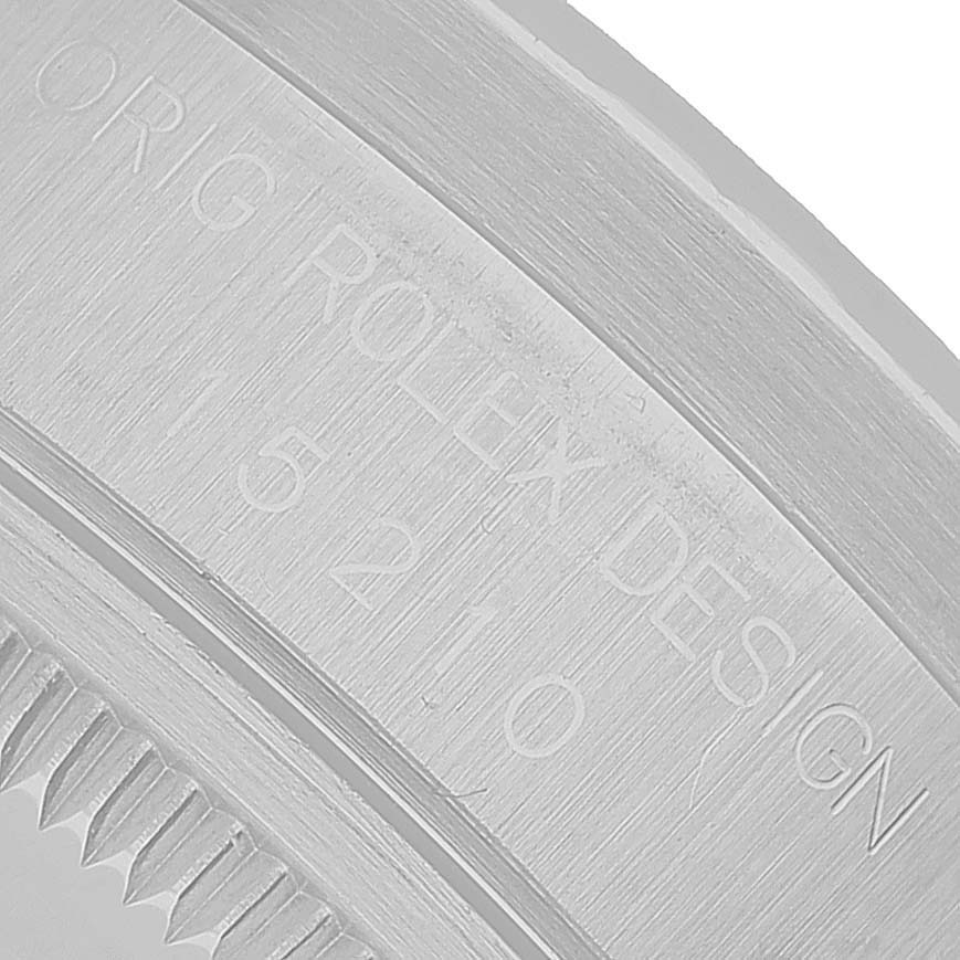 This image shows a close-up of the engraved side of a Rolex Date 15210 Men's Stainless Steel Blue Dial watch, displaying its model number.