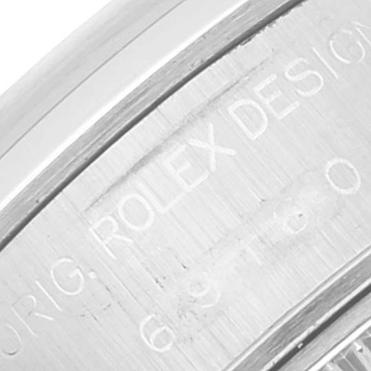The image shows a close-up of the engravings on the inner bezel of a Rolex Date 69160 Women's Stainless Steel Pink Dial 69160 Women's Stainless Steel Pink Dial model watch.