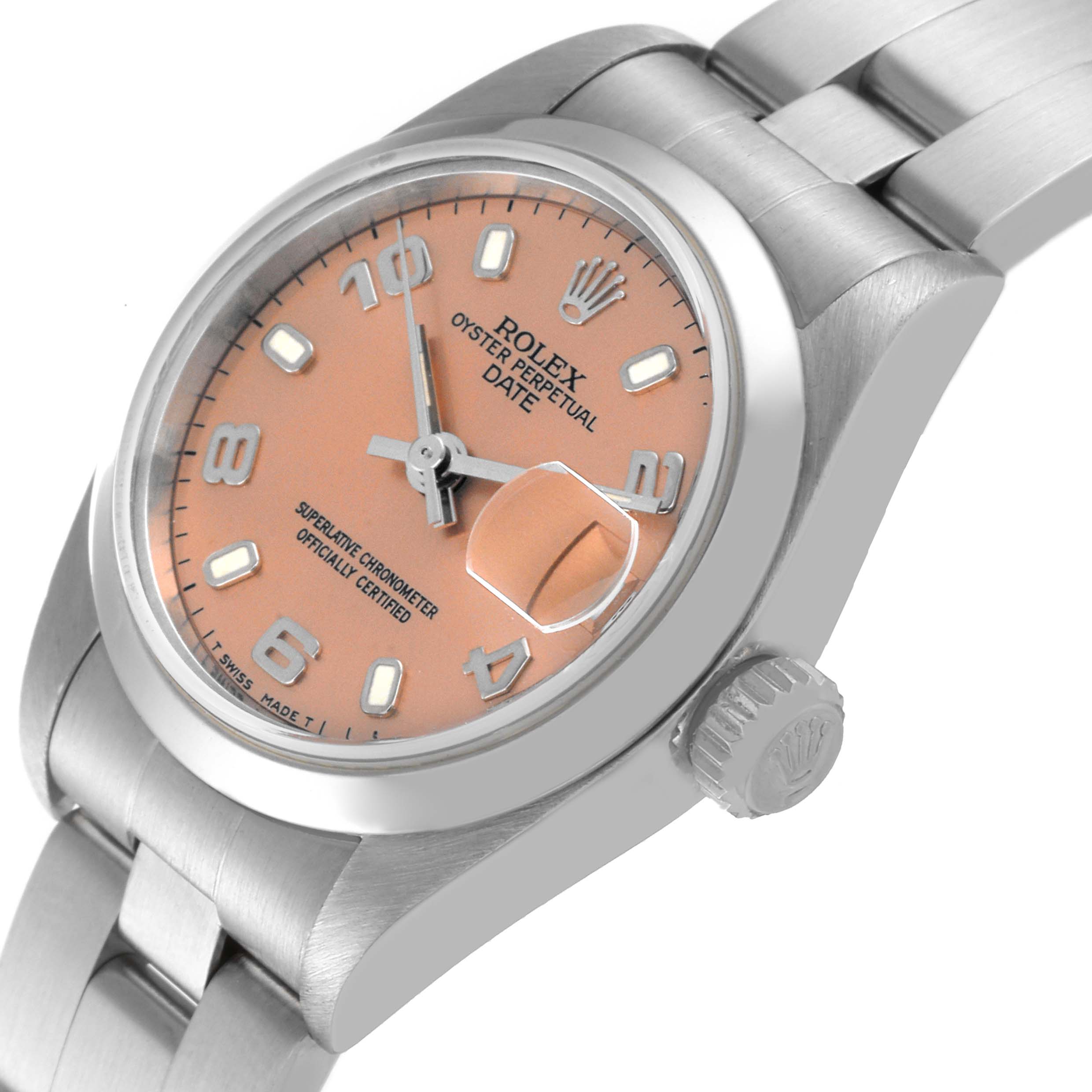 The image shows a Rolex Oyster Perpetual Date watch at a three-quarter angle, highlighting the pink dial, date magnifier, and crown.