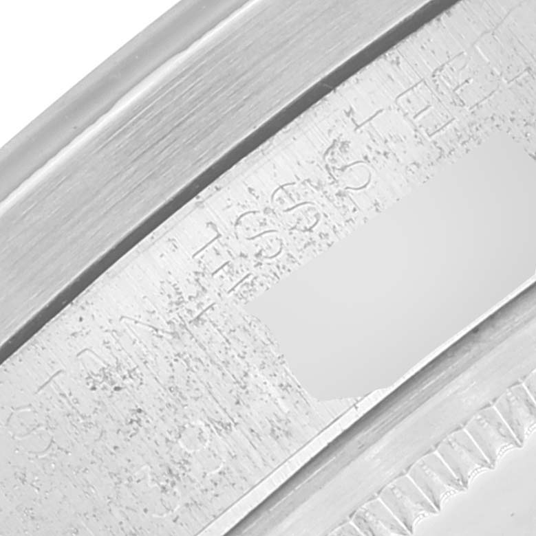 This image shows a close-up of the engraved bezel and case of the Rolex Vintage Collection 1501 Men's Stainless Steel Silver Dial 1501 Men's Stainless Steel Silver Dial model.