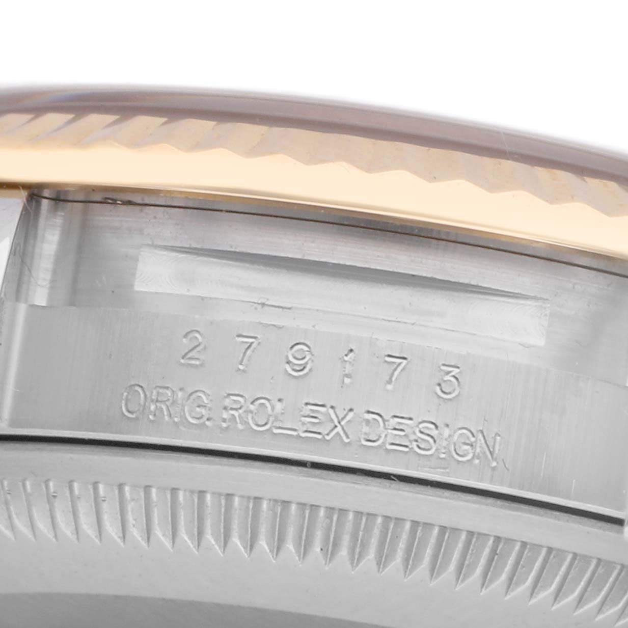 The image shows a close-up of the side of a Rolex Datejust 279173 Women
s Steel and Gold (two tone) White Dial 279173 Women
s Steel and Gold (two tone) White Dial watch, focusing on the serial number and bezel edge.