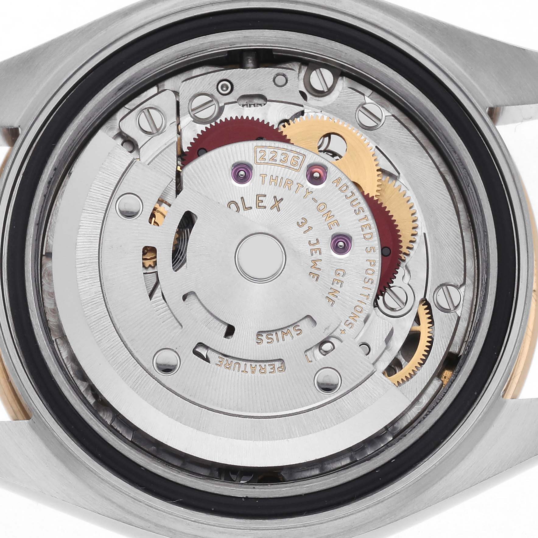 The image shows the movement of a Rolex Datejust 279173 Women
s Steel and Gold (two tone) White Dial 279173 Women
s Steel and Gold (two tone) White Dial watch from a back view, revealing its intricate gears and components.