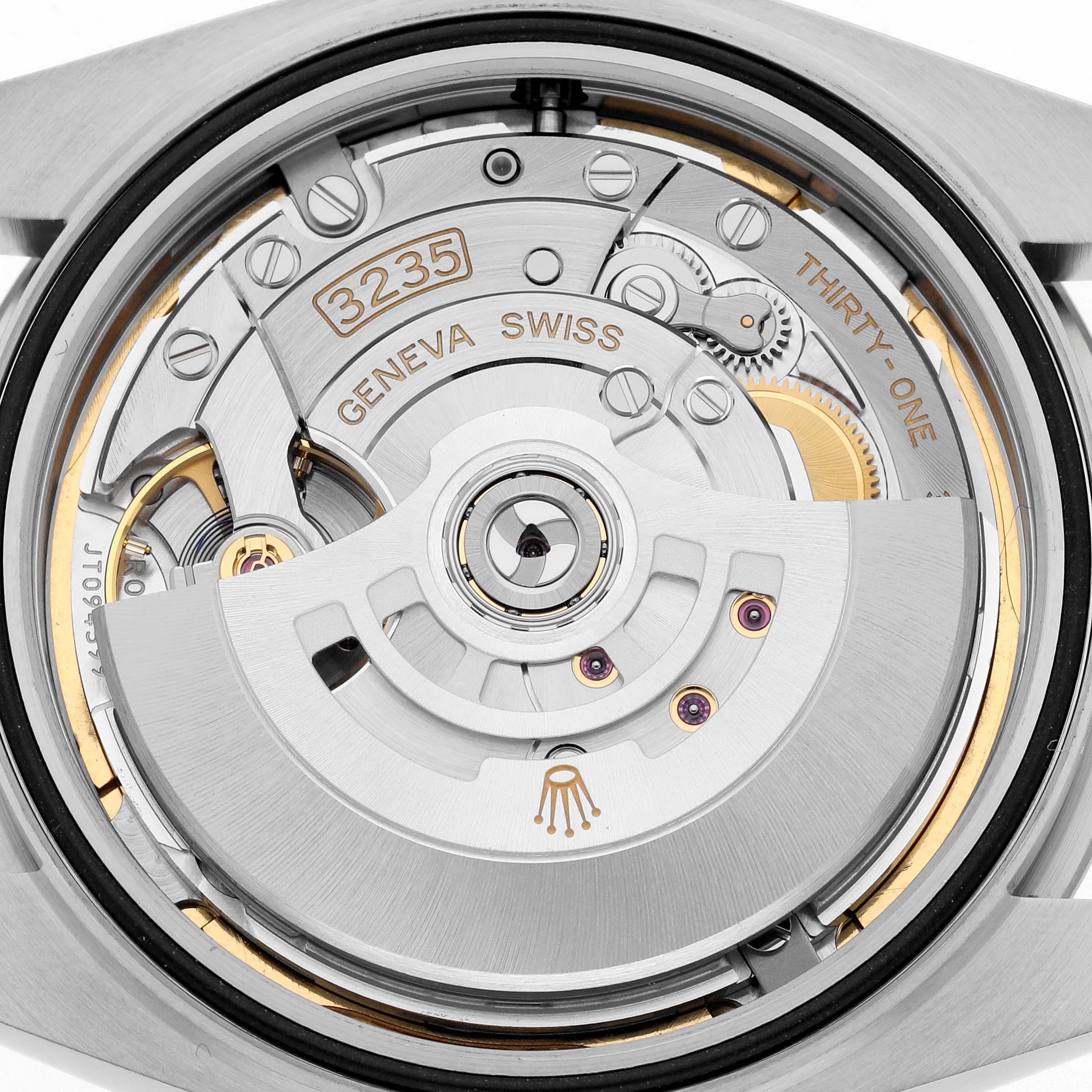 The image shows a close-up of the movement mechanism in the Rolex Datejust 41 126334 Men
s Stainless Steel Blue Dial 126334 Men
s Stainless Steel Blue Dial watch, highlighting the rotor and gears.