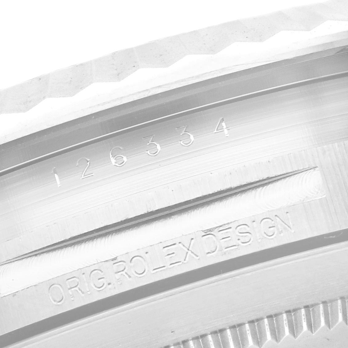 The image shows a close-up of the Rolex Datejust 41 126334 Men
s Stainless Steel Blue Dial 126334 Men
s Stainless Steel Blue Dial bezel and inner ring, with engraved markings.