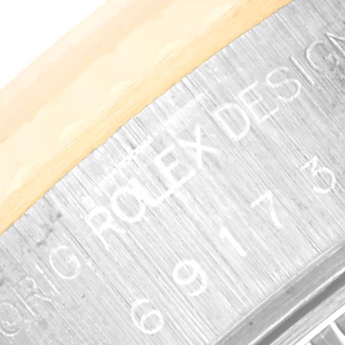 This image shows a close-up of the serial engraving on the side of a Rolex Datejust 69173 Women's Steel and Gold (two tone) Champagne Dial 69173 Women's Steel and Gold (two tone) Champagne Dial watch case.