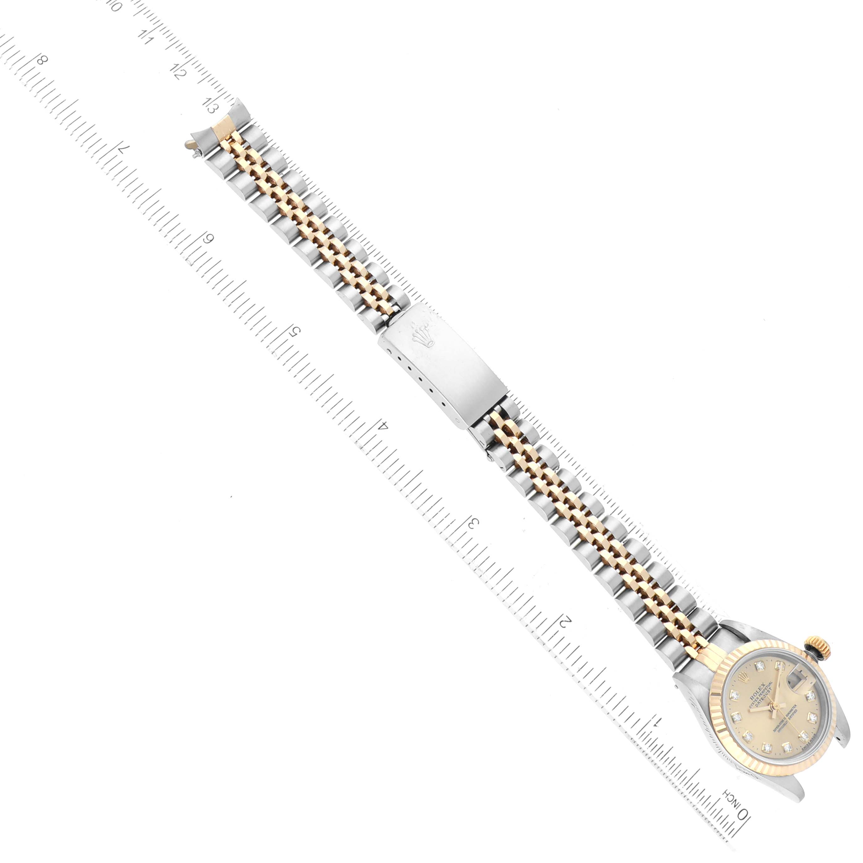 The image shows a Rolex Datejust 69173 Women's Steel and Gold (two tone) Champagne Dial 69173 Women's Steel and Gold (two tone) Champagne Dial watch from a top-down angle, displaying the entire band, clasp, and face of the watch.