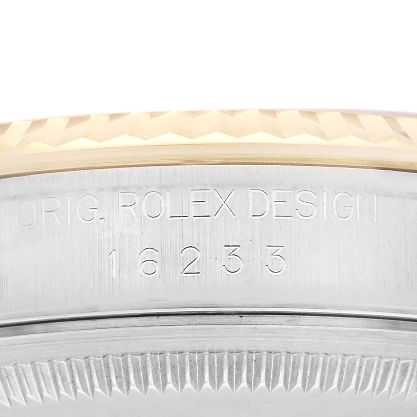 This image shows a close-up of the case side of a Rolex Datejust 16233 Men's Steel and Gold (two tone) Black Dial 16233 Men's Steel and Gold (two tone) Black Dial, specifically highlighting the engravings and edge of the bezel.
