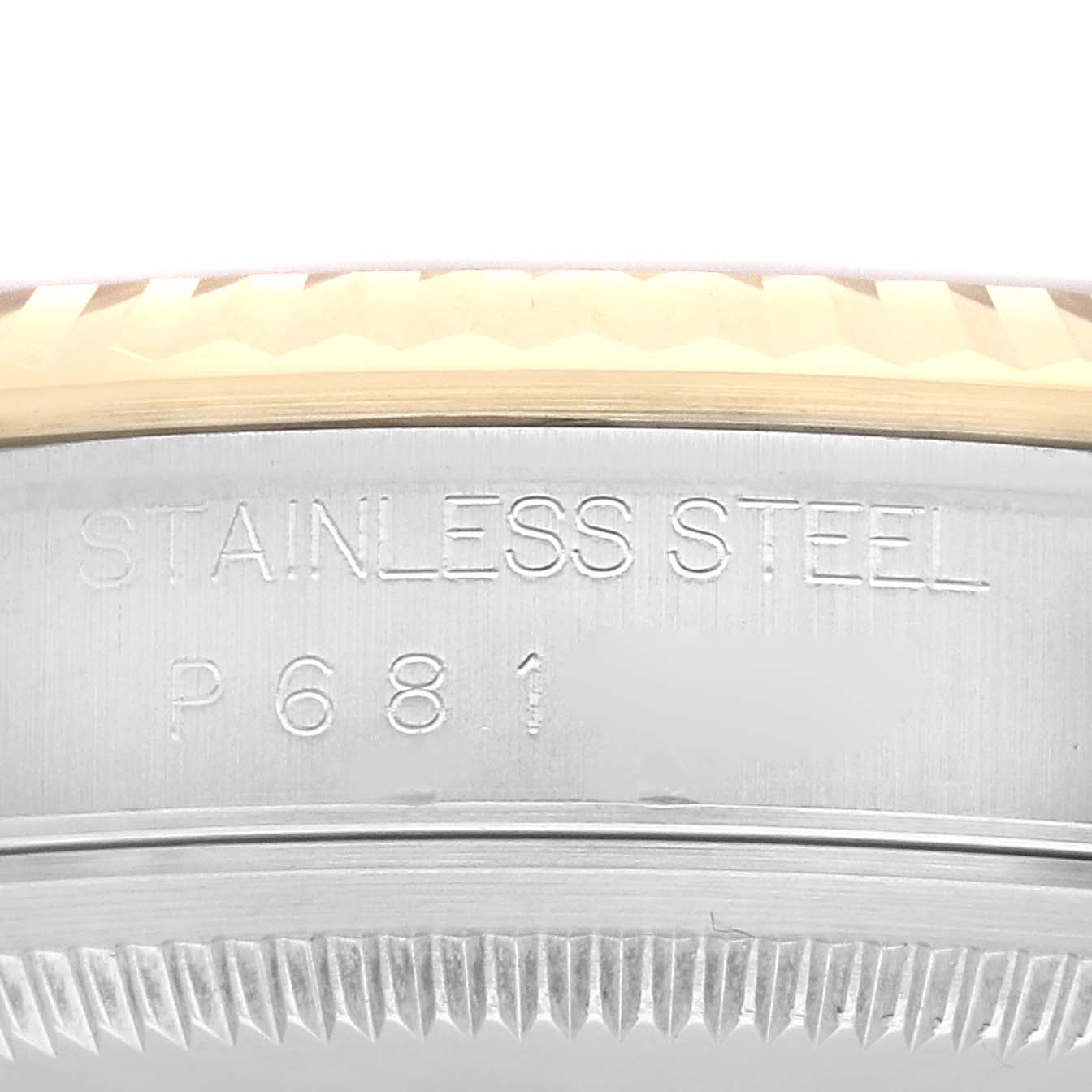 The image shows a close-up of the side of the bezel and case of a Rolex Datejust 16233 Men's Steel and Gold (two tone) Black Dial 16233 Men's Steel and Gold (two tone) Black Dial watch, highlighting the stainless steel engraving.