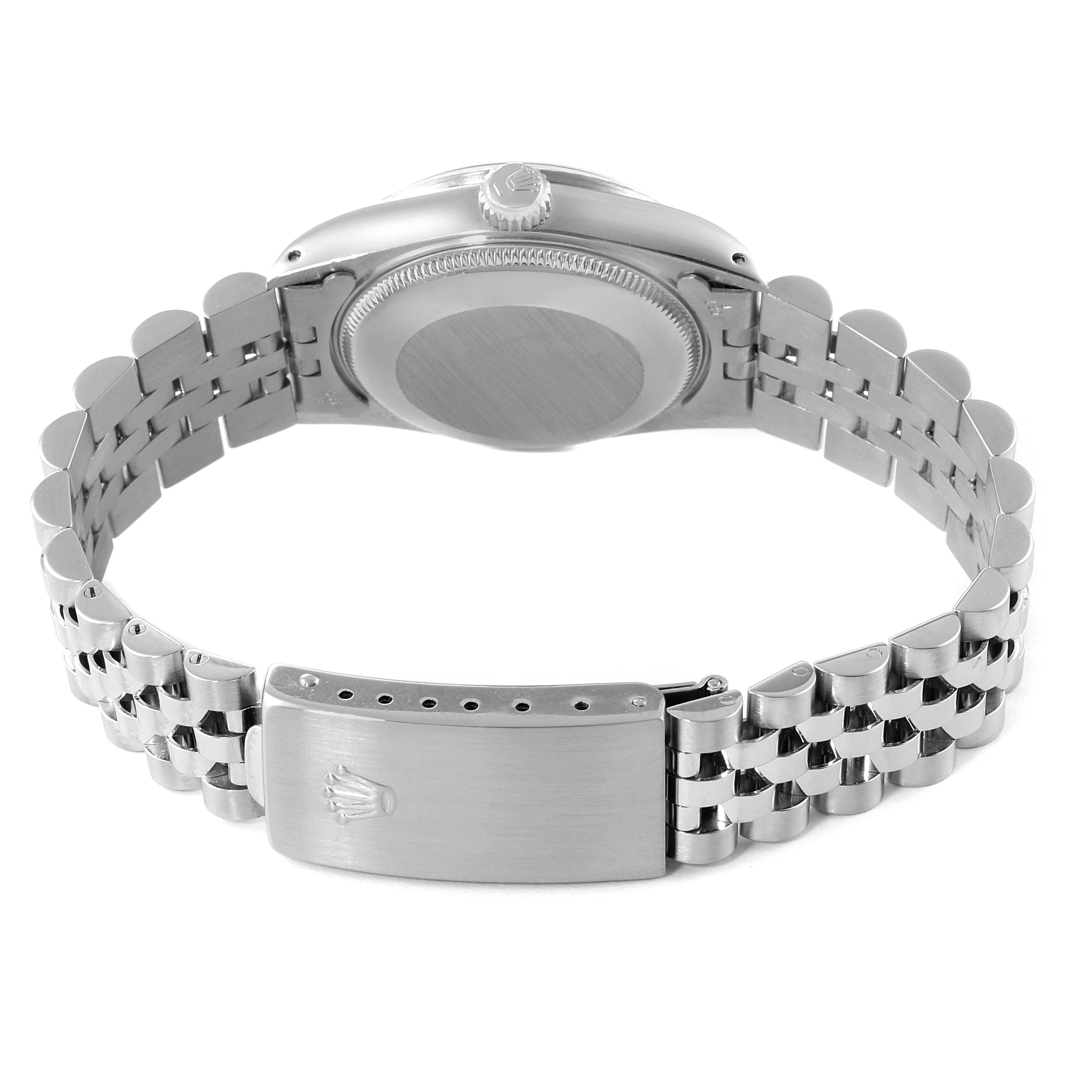 This image shows the back view and bracelet of a Mid-Size Rolex watch, highlighting the clasp and case back.