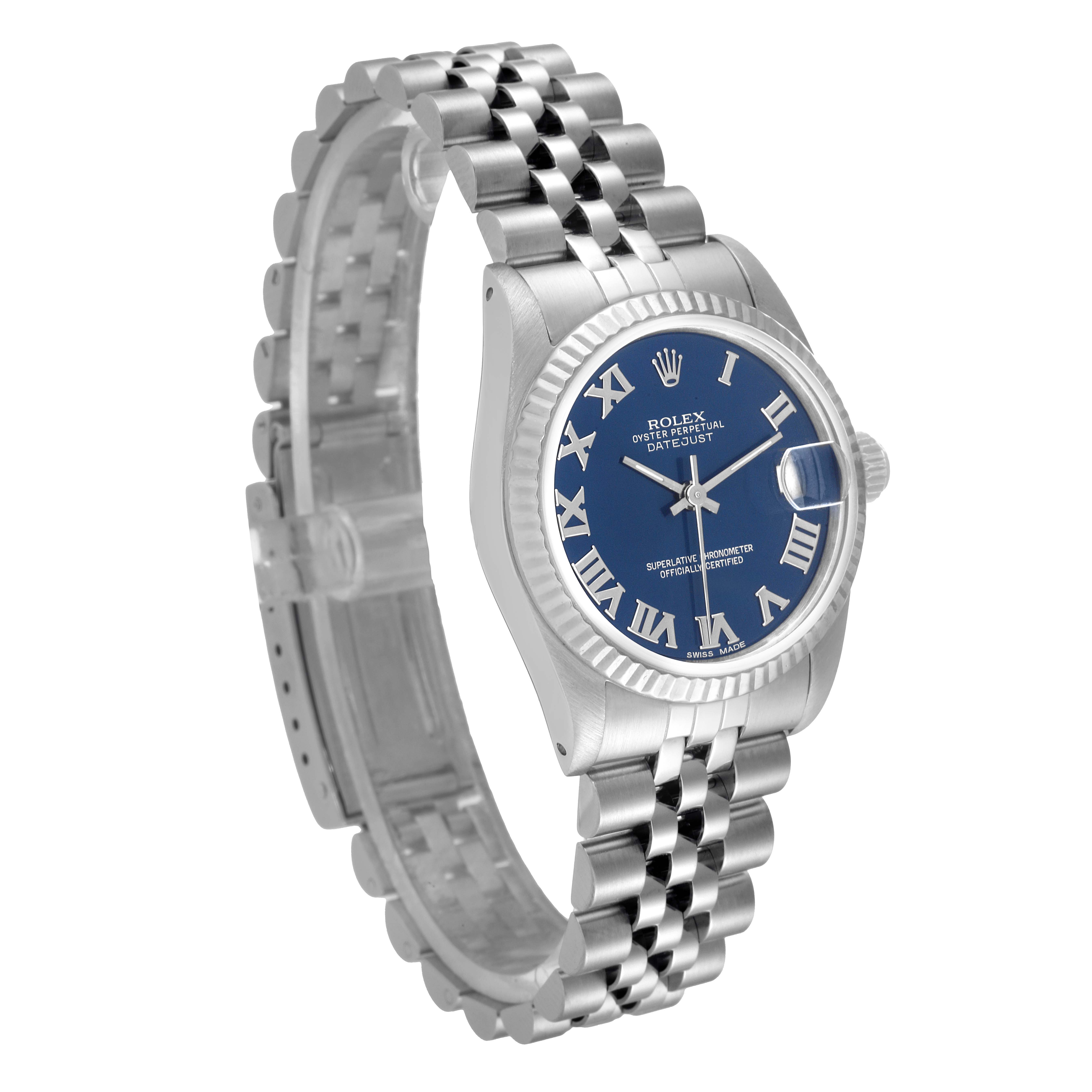 This image shows a Rolex Mid-Size 68274 Women's Stainless Steel Blue Dial 68274 Women's Stainless Steel Blue Dial Oyster Perpetual Datejust watch angled from the front, displaying its blue dial, Roman numerals, and metal bracelet.