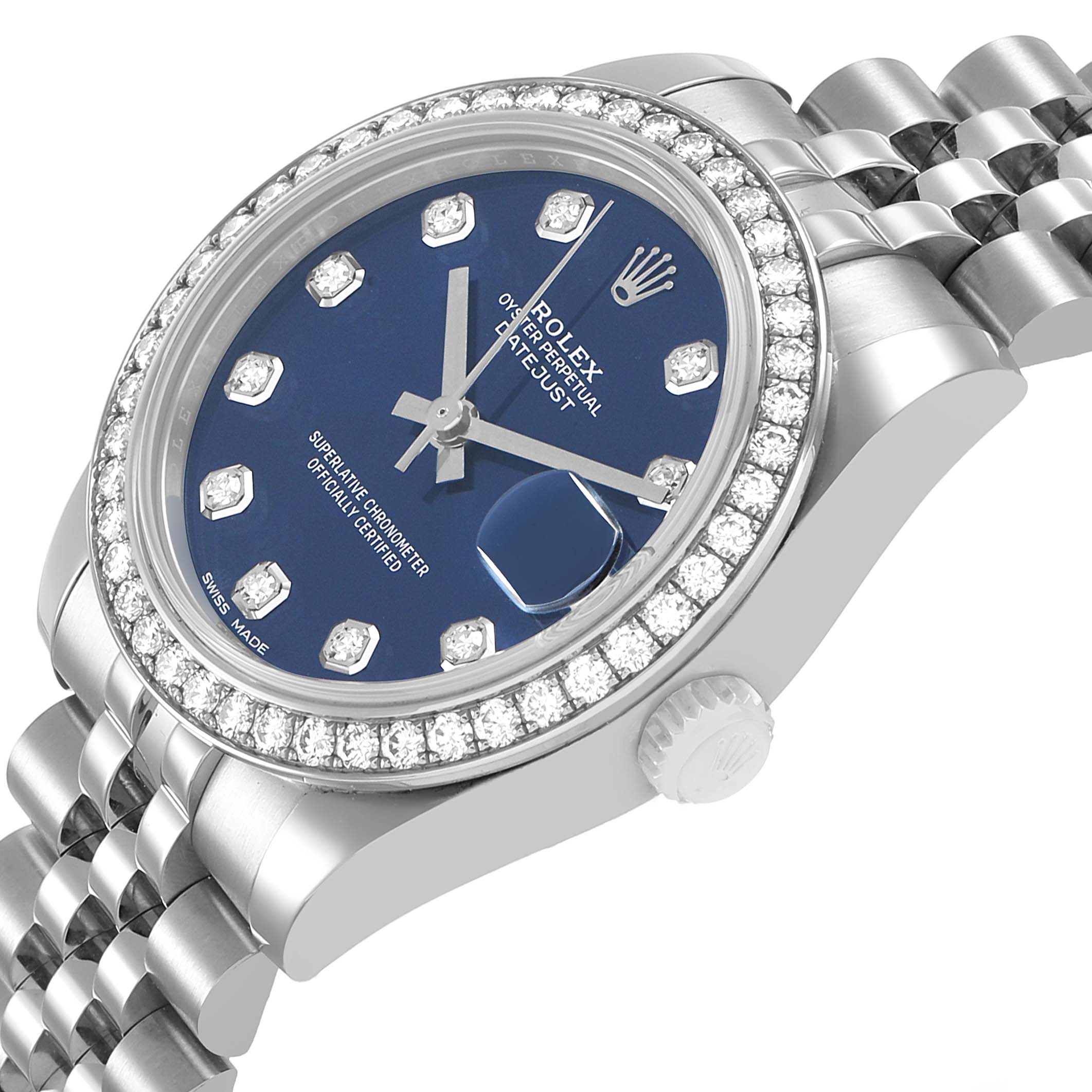 The Rolex Datejust 178384 Women's Stainless Steel Blue Dial watch is shown at an angled view, highlighting the diamond bezel, blue dial, and part of the bracelet.