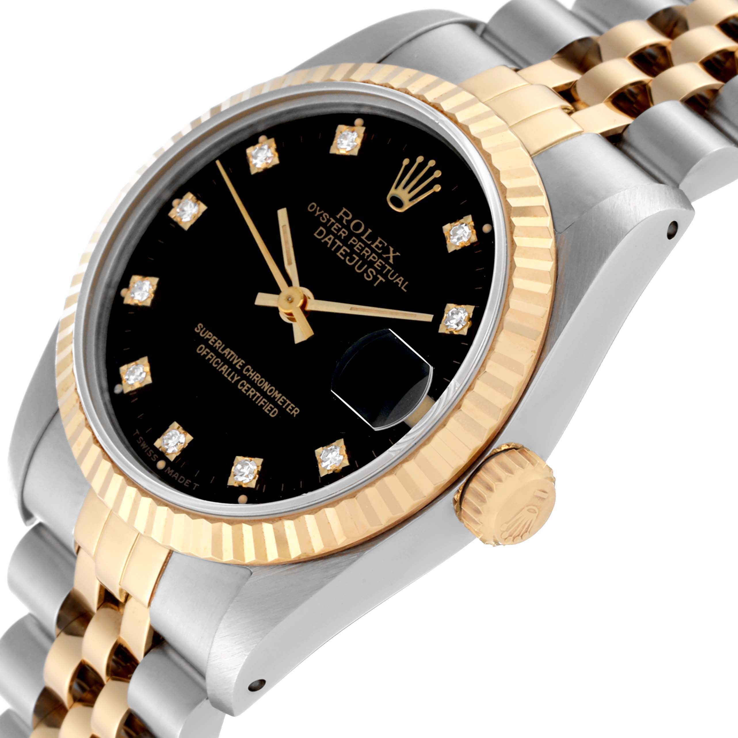 The image shows a close-up side angle of the Rolex Mid-Size 68273 Women's Steel and Gold (two tone) Black Dial 68273 Women's Steel and Gold (two tone) Black Dial Datejust, highlighting its dial, bezel, and crown.