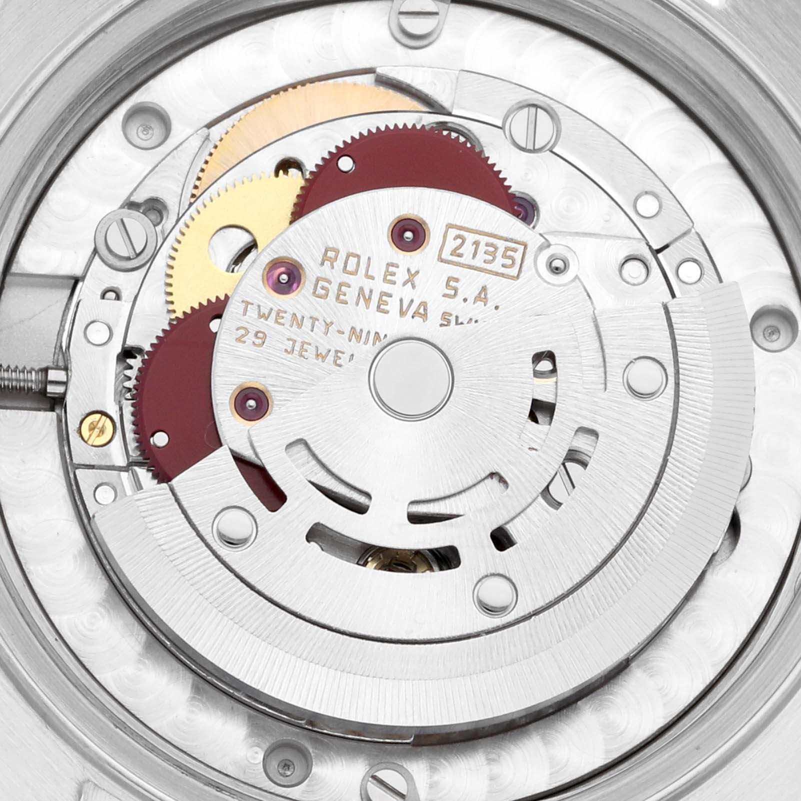 This image shows a detailed view of the movement of a Mid-Size Rolex watch, highlighting gears and the rotor.