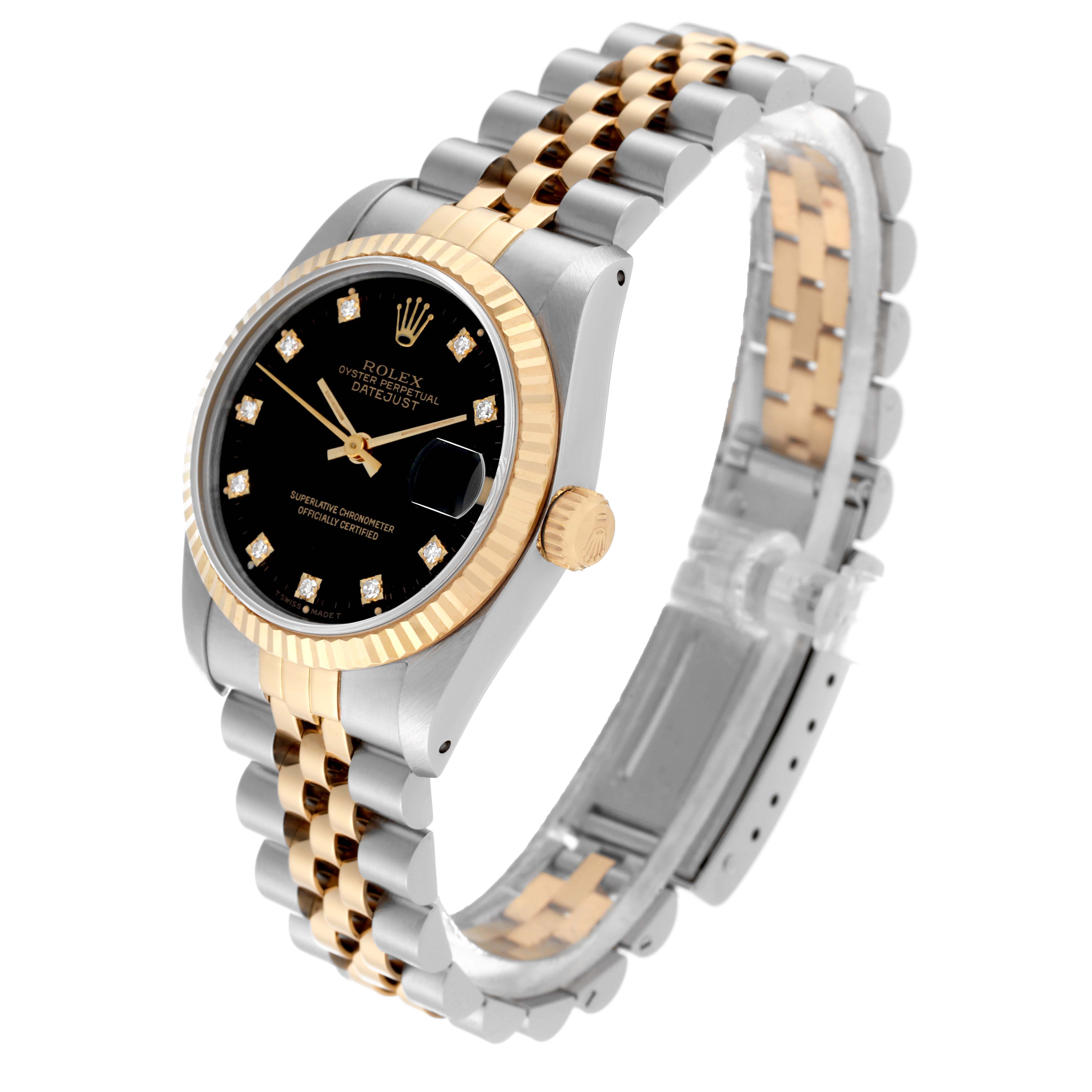 This Mid-Size Rolex features a side-angle view, showcasing its two-tone bracelet, black dial, and fluted bezel.