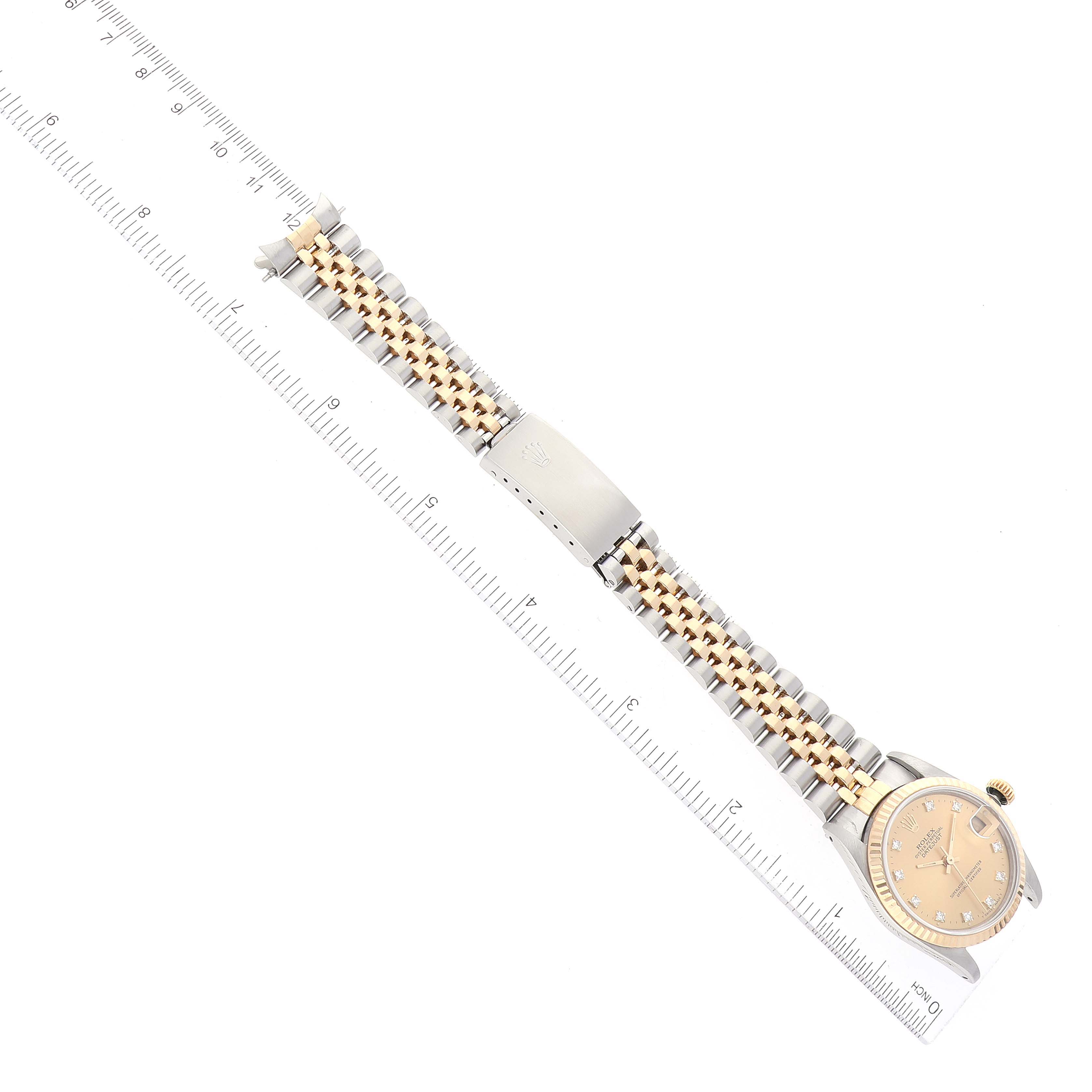 The image shows a top-down view of a Mid-Size Rolex watch, highlighting its dial, bezel, and two-tone bracelet.
