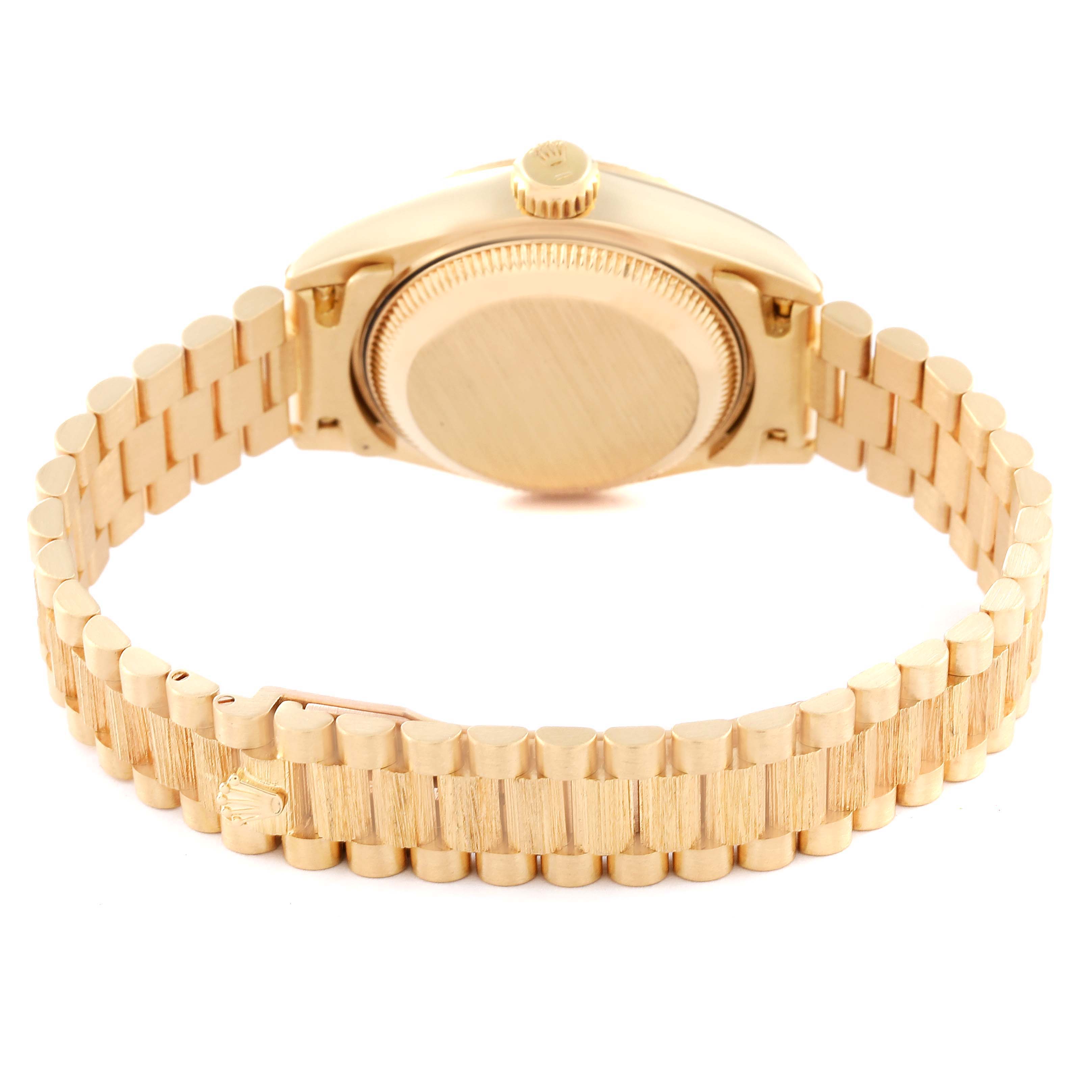 This image shows the back view of a Rolex President 69278 Women's Yellow Gold Champagne Dial 69278 Women's Yellow Gold Champagne Dial model watch, highlighting its bracelet and case back.
