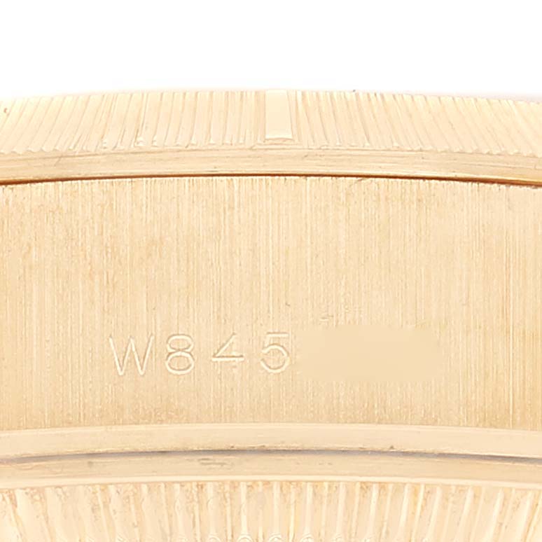 The image shows a close-up view of the side, displaying the Rolex President 69278 Women's Yellow Gold Champagne Dial 69278 Women's Yellow Gold Champagne Dial model's serial number engraving.