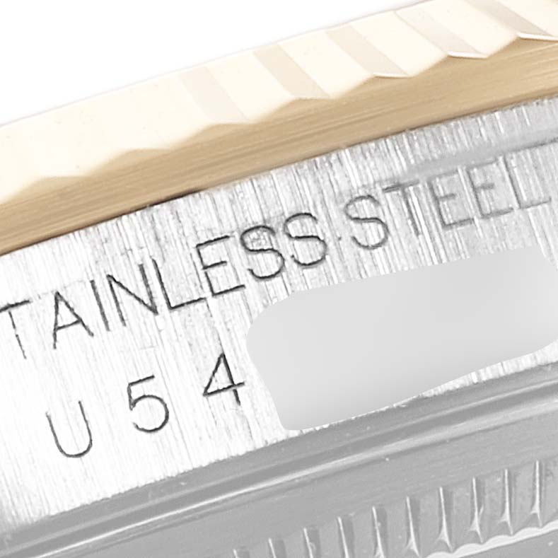 The image shows a close-up of the stainless steel case and fluted bezel of a Rolex Datejust 16233 Men's Steel and Gold (two tone) Blue Dial 16233 Men's Steel and Gold (two tone) Blue Dial watch.