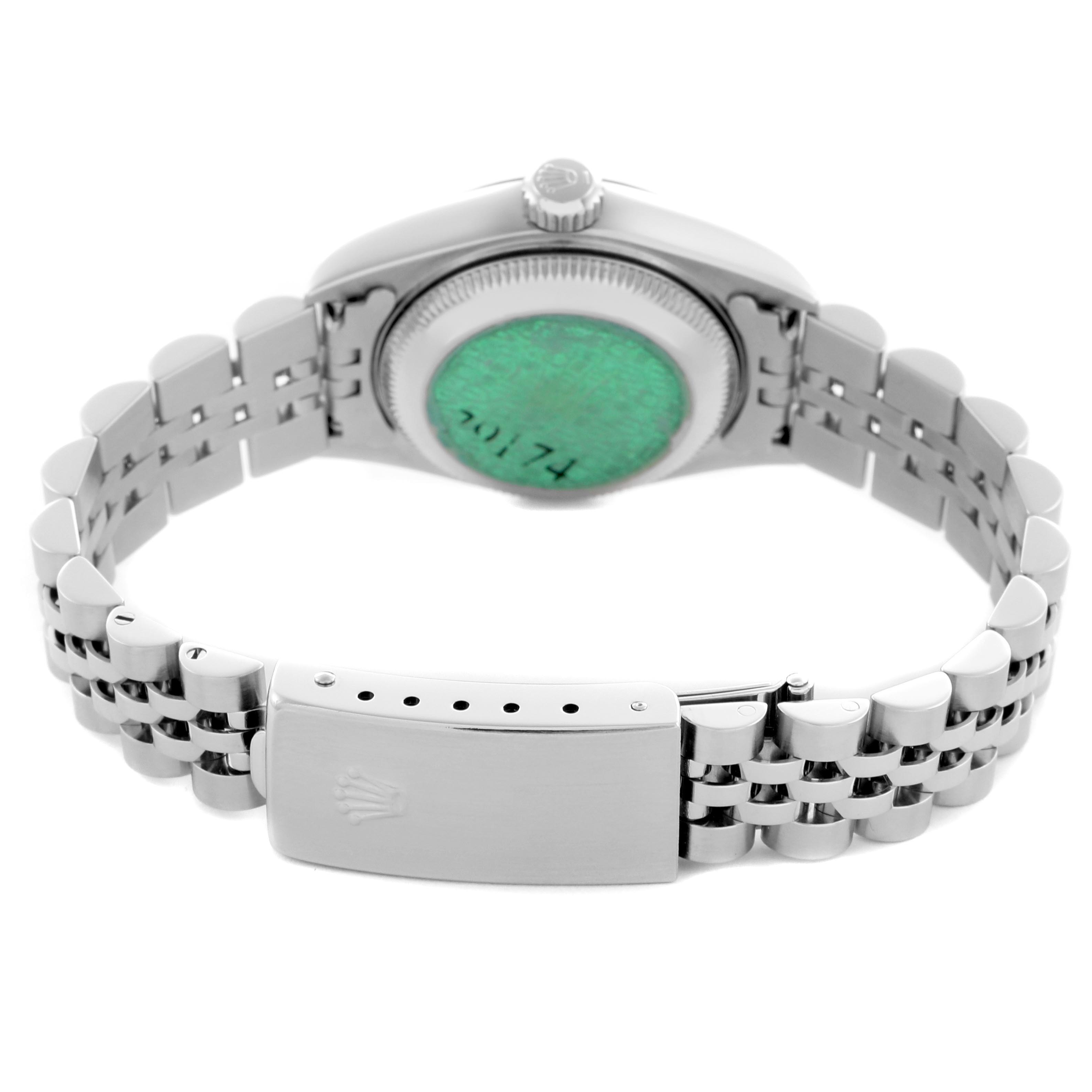 The image shows the back view of a Rolex Datejust 79174 Women
s Stainless Steel Mother of Pearl Dial 79174 Women
s Stainless Steel Mother of Pearl Dial, highlighting the clasp and bracelet links.