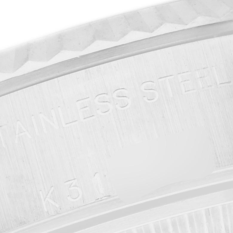 The image shows a close-up of the case edge with the fluted bezel of a Rolex Datejust 79174 Women
s Stainless Steel Mother of Pearl Dial 79174 Women
s Stainless Steel Mother of Pearl Dial, highlighting the stainless steel material.