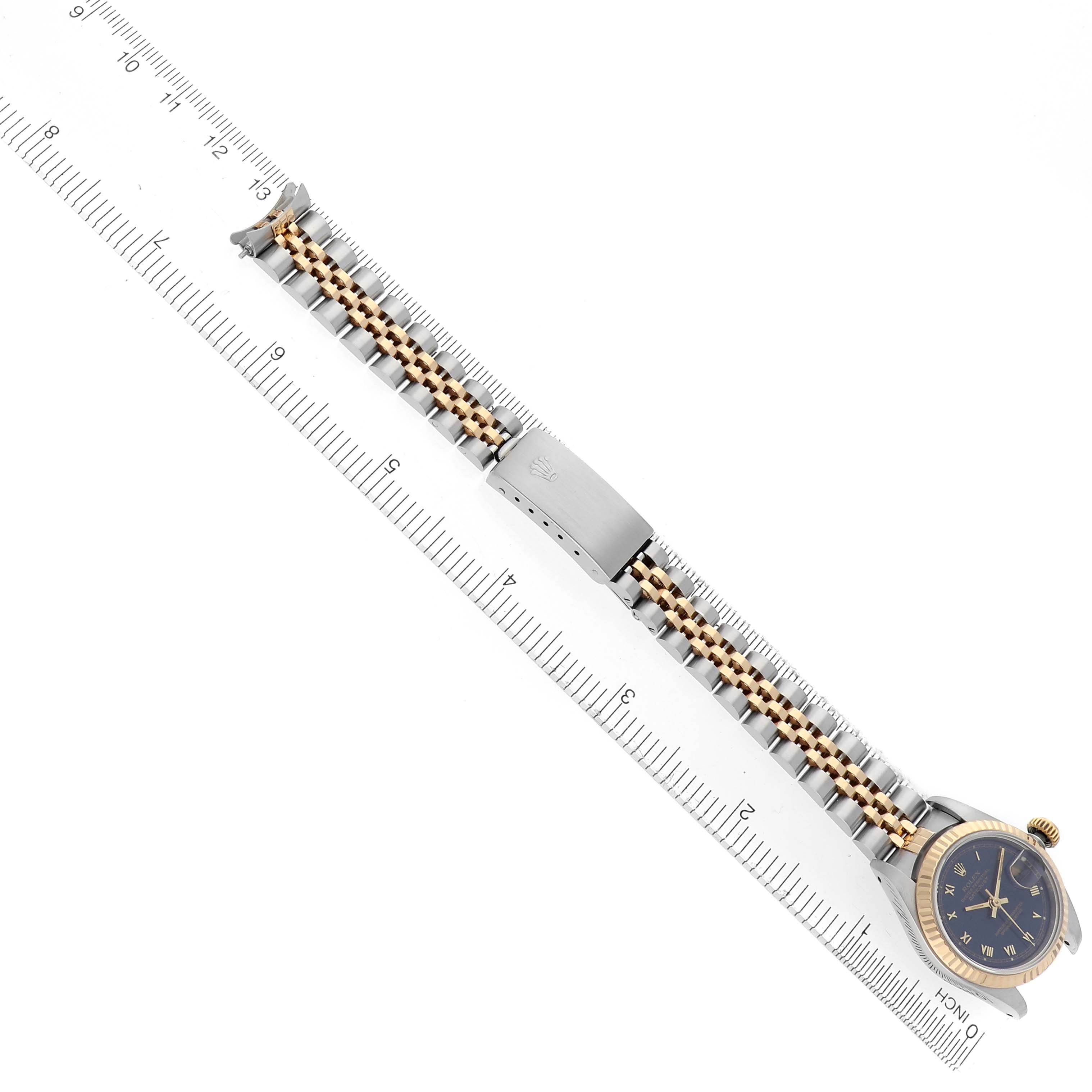 The image shows a Rolex Datejust 69173 Women's Steel and Gold (two tone) Blue Dial 69173 Women's Steel and Gold (two tone) Blue Dial watch laid flat, displaying its full bracelet and clasp alongside a ruler for scale.