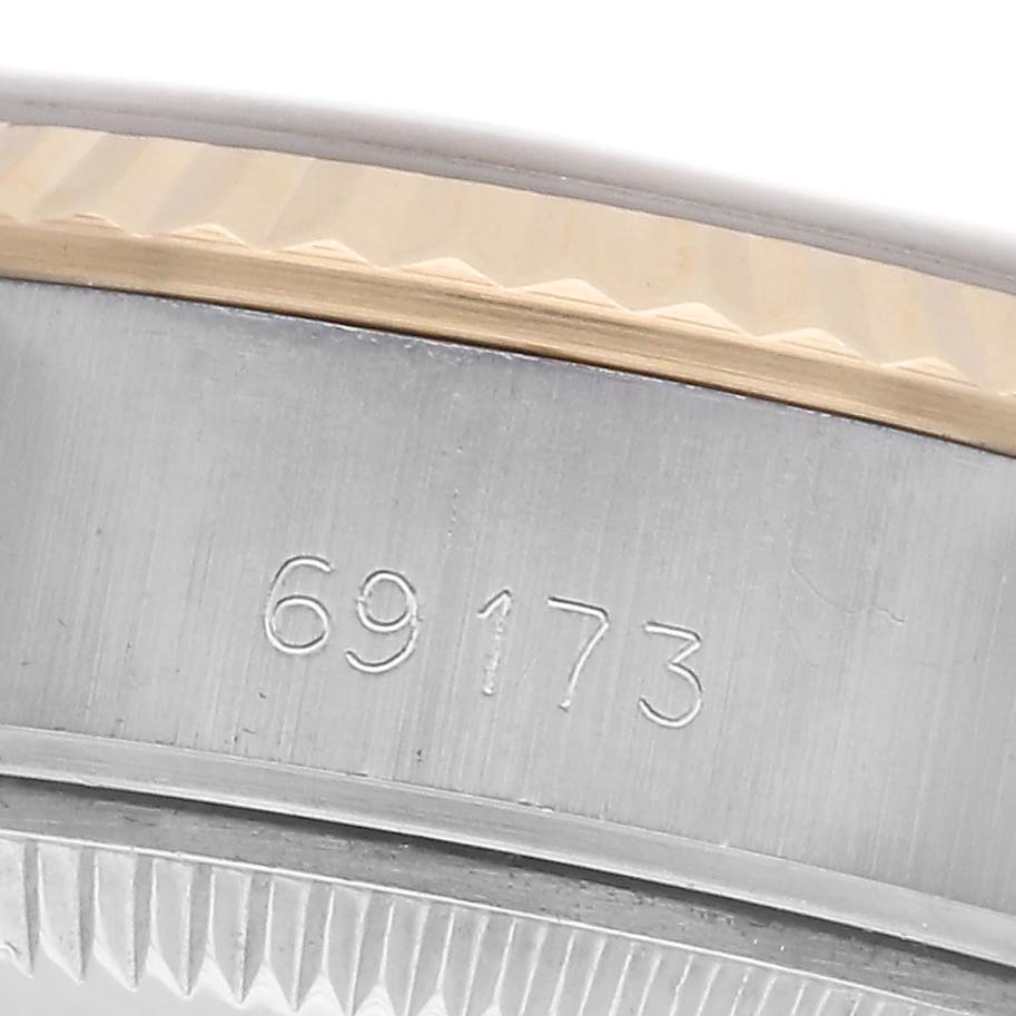 The image shows a close-up of the case side of a Rolex Datejust 69173 Women's Steel and Gold (two tone) Blue Dial 69173 Women's Steel and Gold (two tone) Blue Dial, highlighting the reference number and the fluted bezel.