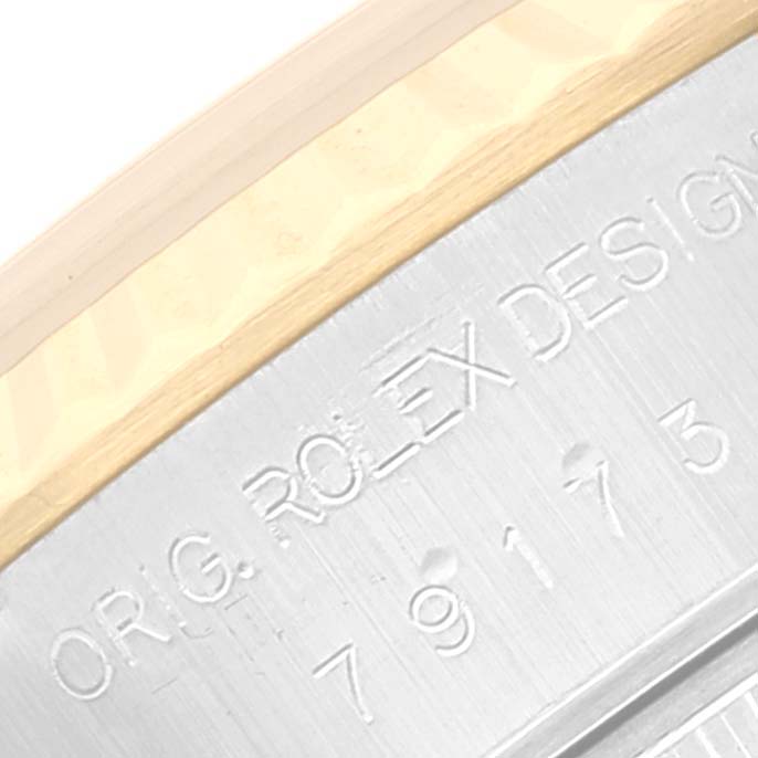 The image shows a close-up of the model number engraving on the side of the Rolex Datejust 79173 Women's Steel and Gold (two tone) Champagne Dial 79173 Women's Steel and Gold (two tone) Champagne Dial watch case.