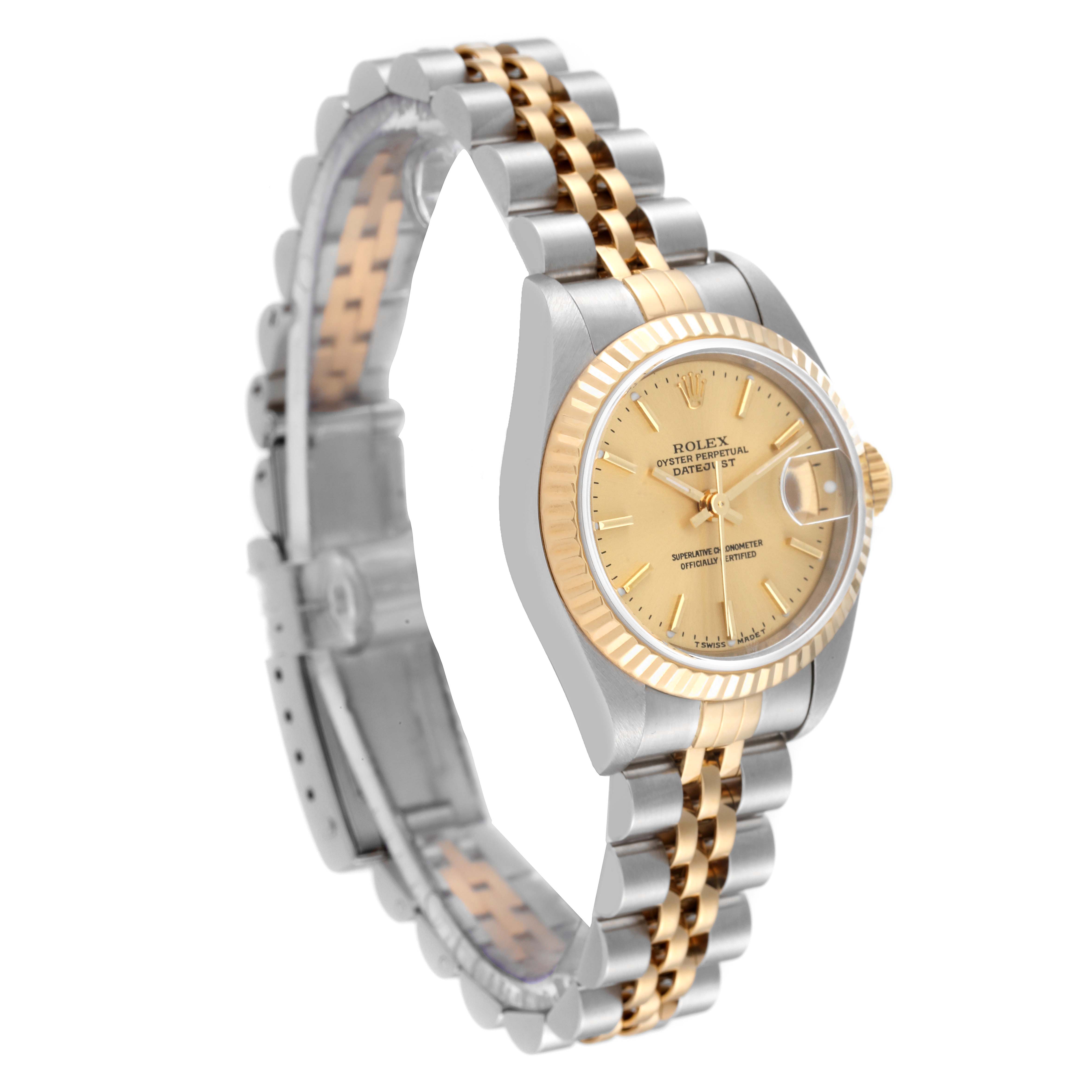 The Rolex Datejust 79173 Women's Steel and Gold (two tone) Champagne Dial 79173 Women's Steel and Gold (two tone) Champagne Dial watch is shown at an angled view, highlighting its two-tone bracelet, fluted bezel, and champagne dial.