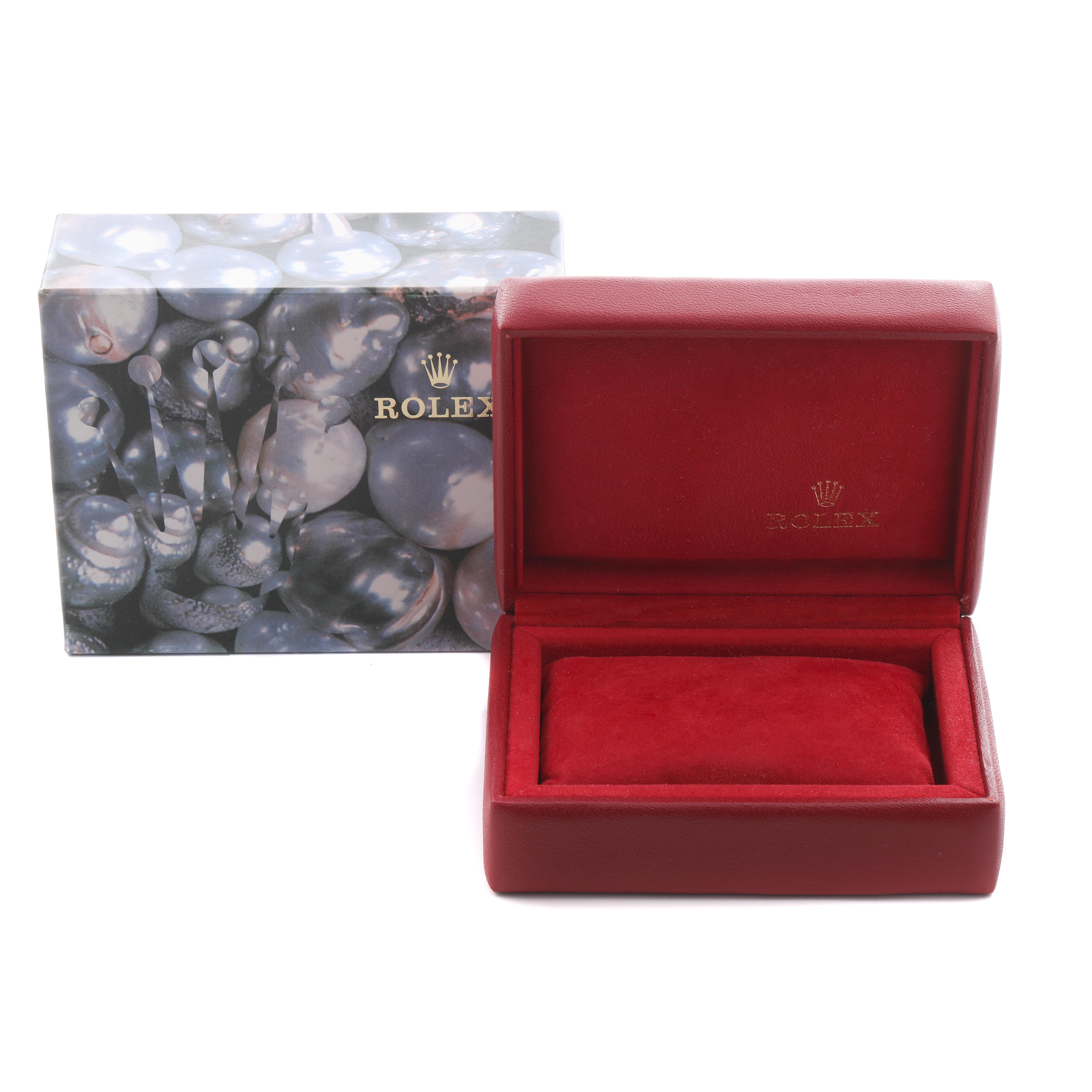 The image shows a Rolex Datejust 69173 Women
s Steel and Gold (two tone) White Dial 69173 Women
s Steel and Gold (two tone) White Dial box and packaging, featuring a red interior and decorative outer box.