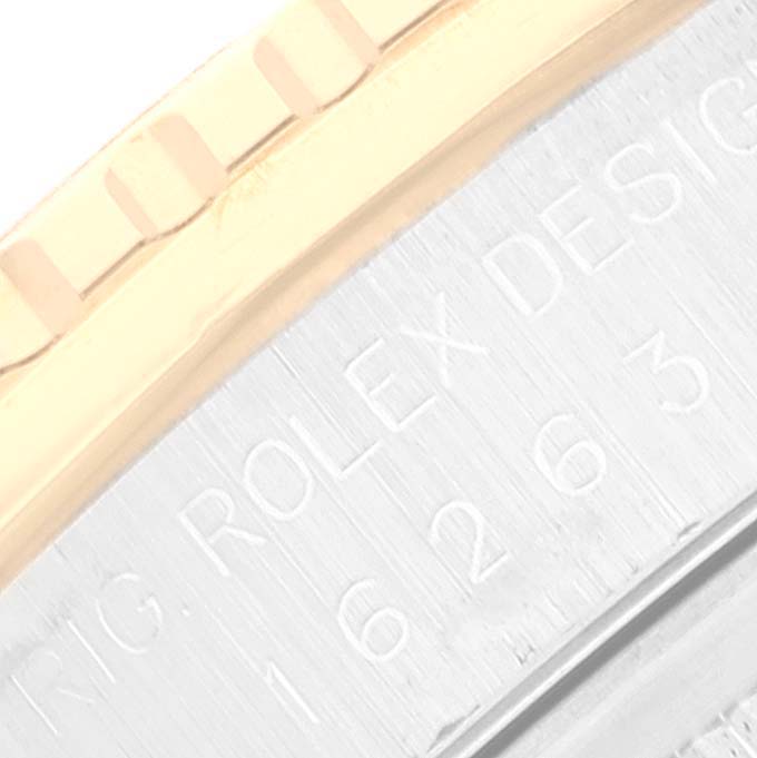 This close-up image shows the engraved details on the case side of a Rolex Turn-o-Graph 16263 Men
s Steel and Gold (two tone) Black Dial 16263 Men
s Steel and Gold (two tone) Black Dial watch.