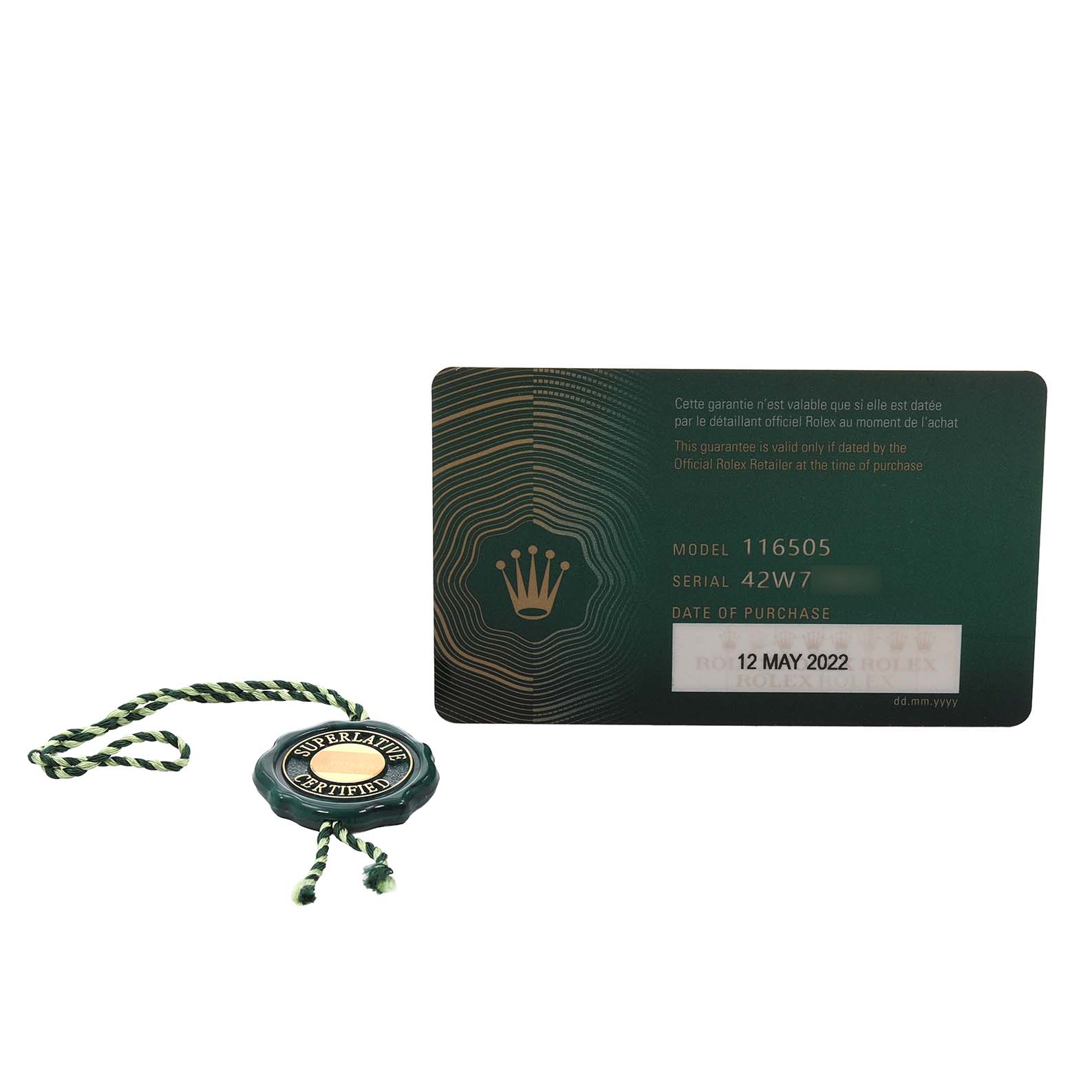 The image shows a Rolex Daytona 116505 Men's Rose Gold Pink Dial warranty card and a green Rolex tag with a braided string.