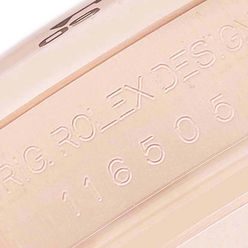 The image shows a close-up of the engraved case with model number on the Rolex Daytona 116505 Men's Rose Gold Pink Dial watch bezel.