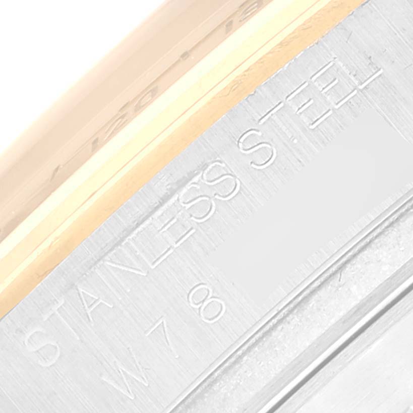 This image shows a close-up of the text engraved on the stainless steel case back of a Rolex Daytona 16523 Men's Steel and Gold (two tone) Black Dial 16523 Men's Steel and Gold (two tone) Black Dial watch.