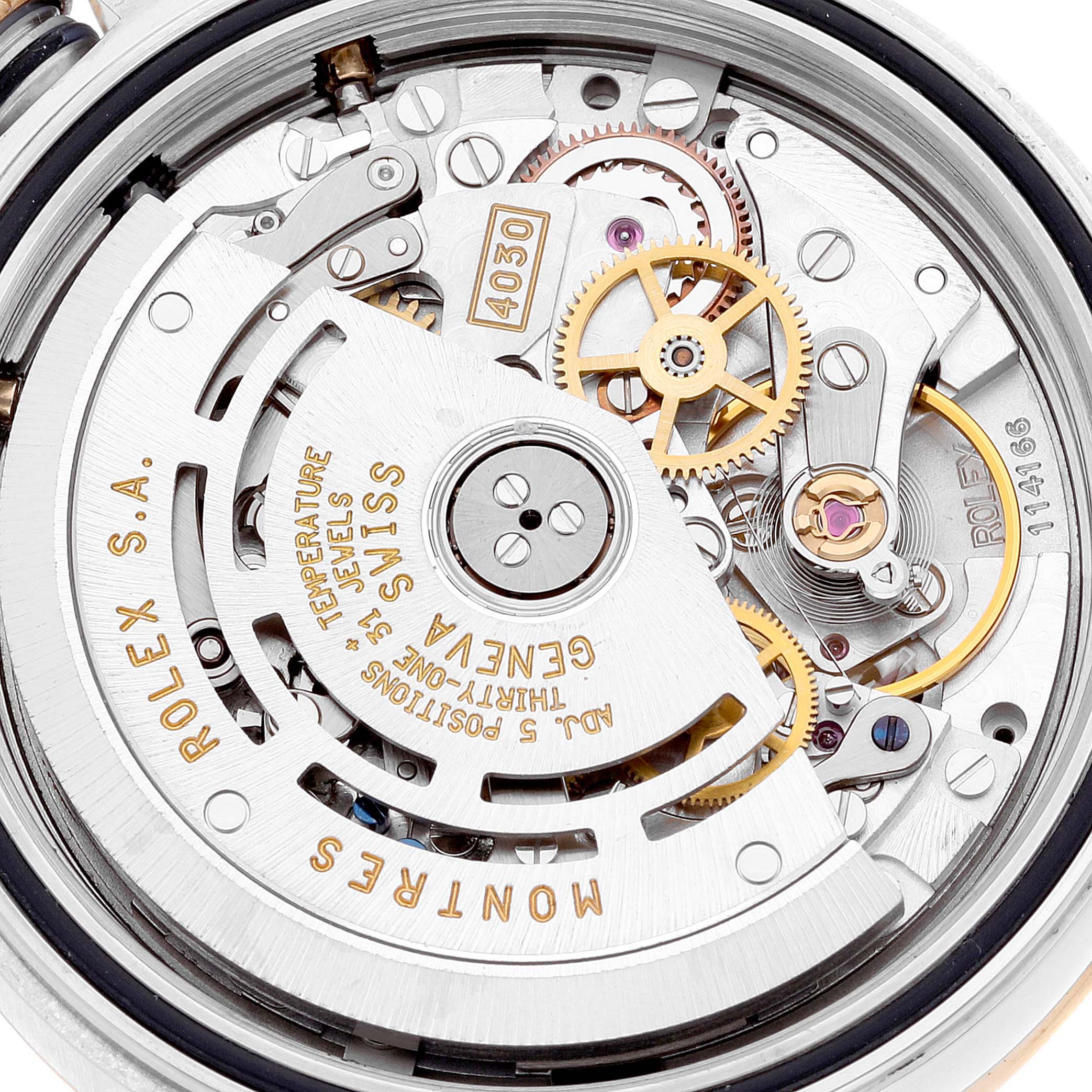 This is a close-up view of the movement mechanism of a Rolex Daytona 16523 Men's Steel and Gold (two tone) Black Dial 16523 Men's Steel and Gold (two tone) Black Dial watch.